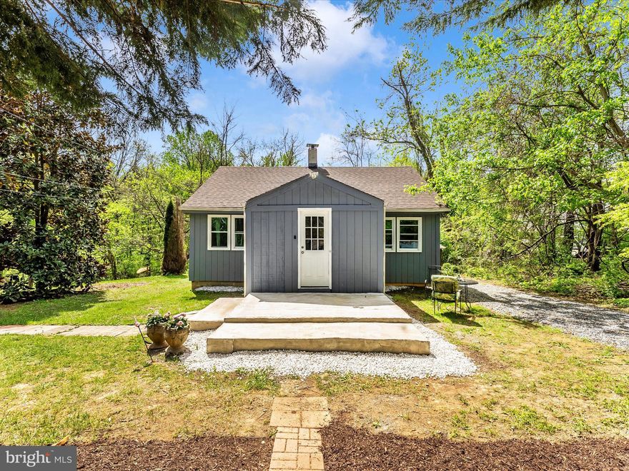 Charming bungalow with a RECORDED 6 BED PERC and approved septic site plan in the Ag Reserve! Rare STARTER HOME in the Poolesville School district with the POTENTIAL TO GROW WITH YOU AND YOUR FAMILY! 1 acre lot buffered and backed by trees on a quiet country road with quick access to State Route 28, I-270, MARC Train, Sugarloaf Mountain, both Monocacy and Potomac Rivers, and everything else the Ag Reserve has to offer. This home features NEW T1-11 siding, roofing, windows, newer HVAC, heat pump (2 years) and ductwork, updated 200 amp electric panel, 300 gallon holding tank with pressure pump, softener, and three stage filtration. Enter through the enclosed porch to an open kitchen/living room combo with rustic hardwood floors and light filled new windows. The kitchen is anchored by a generous island with useful counter space and ample built-in storage. An oversized stainless sink, glass cabinets, and tile flooring compliment the open kitchen space. Additional pantry space and front load washing and drying machines can be found in the laundry room off the back of the kitchen. Two large bedrooms and a full bath with a shower/tub combo complete the main level.  A third room that is being used as storage could easily be converted into a third bedroom. The loft/attic area features shelving for storage and two heat extractors. The crawl space has moisture barrier material over the dirt floor and houses the new water heater, furnace, filtration system, holding tank, and electric panel.