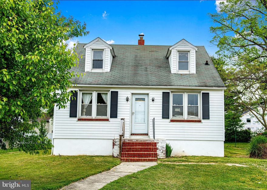 Charming Cape Cod single-family home in Parkville. Step inside to a welcoming entryway with a beautiful wooden banister. Bright living room with hardwood floors and plenty of natural light. Spacious dining room with a ceiling fan and hardwood floors, located just off the kitchen. The kitchen was updated in 2009 and features laminate countertops, dark maple cabinets, a tile backsplash, tiled flooring, and space for a table. The door from the kitchen leads to the large level backyard. The main level includes one bedroom with crown molding and a full bath with a tiled shower surround. The upper level offers two additional bedrooms with the traditional dormer-style windows and sloped ceiling. Hardwood flooring runs throughout the home. Unfinished basement provides plenty of storage and includes a walk-up exit, a sump pump, and updated electrical. Enjoy two small porches, one in the front and one in the back. This home is SUPER CHARMING and priced to sell. Home is being sold as-is.