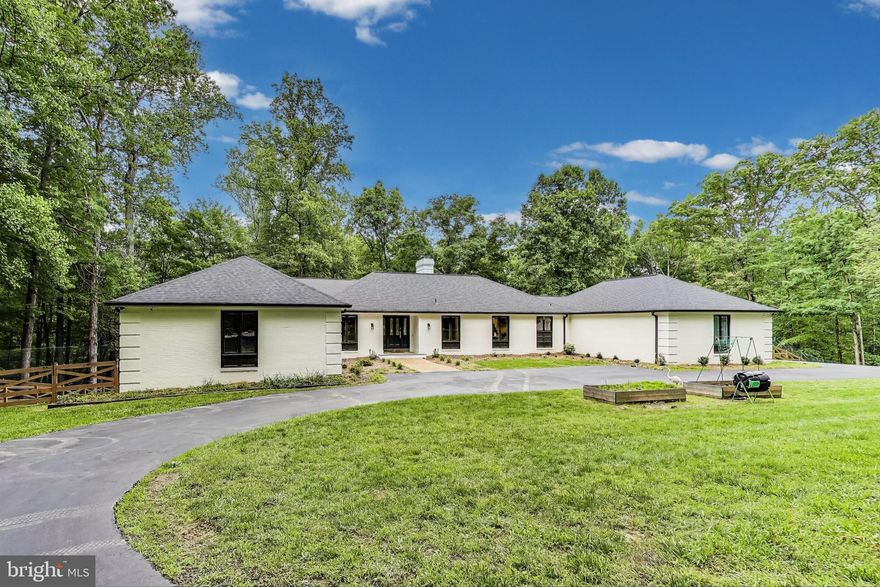 Escape to your own private paradise just minutes from Historic Old Town Clifton! Located on just over 10 acres of land (2 separate parcels, so the possibilities are endless), this stunning estate offers a quiet escape filled with modern conveniences. This expansive rambler has over 3600 square feet of finished living space on the main level, including an amazing primary retreat with private home office, ensuite bath and dual walk-in closets. The spa-like shower has double shower heads and tons of vanity space to spread out. The secondary bedrooms are also generously sized and share a Jack & Jill style bathroom. There are two large living rooms with a back wall of windows that floods the space with natural light and cozy fireplaces to enjoy in the crisp winters. The kitchen has also recently been updated with quartz countertops, a hidden appliance garage, stainless appliances and loads of cabinet and counter space. Off the kitchen area there is a half bath for your convenience and a fabulous laundry room/mud room, with entrance from the 2-car attached garage. Downstairs you will find another roughly 700 square feet of finished space, including a work shop, game room/bar and fitness area. Plenty of space on this walk-out level to add additional bedrooms as well, not to mention tons of storage room. 

Imagine starting your day hearing the birds singing while you enjoy a cup of coffee on your rear flagstone patio, looking out over your fully fenced back yard. Better yet, take a stroll on over a mile of wood-chipped walking trails, enjoying the sounds of nature in your private refuge. 

The sellers thought of everything here so you can move right in! The whole home Generac generator will keep you prepared for any storm. The sellers have meticulously completed over $200K of improvements since taking ownership of the home in 2020, including 17 new Andersen casement windows, a new roof (2023), newly sealed driveway (2024) and more (see MLS documents for a full list of updates/improvements). 

The location can't be beat - convenient to major commuter routes, but private and secluded as well.  You will also love the community vibe in Historic Clifton - Farmer's Market, adorable shops and restaurants and you can't miss Peterson's Ice Cream Depot!

Virtual tour, floor plan and drone videos coming soon. Property also has a VA assumable loan at sub 3% rate - call for details.