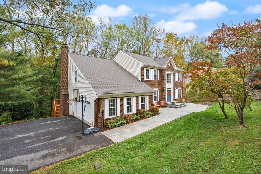 Nestled in the serene Bear Creek subdivision, this colonial estate offers a classic brick front, double-door entry with two-car garage. Step inside to find a thoughtfully designed main level enhanced with rich wood flooring and featuring an open, eat-in kitchen that’s perfect for family meals and gatherings. With its barn door pantry, large island, and plenty of counter space, the renovated gourmet kitchen is the heart of the home. The spacious layout flows easily into the family room, boasting a fireplace and built-in shelving, creating a comfortable space for both everyday living and entertaining. Walk out to the screened-in back porch (built in 2024) or leave the sliding door open to enlarge the space. The formal dining room leads into a cozy sitting area—ideal for relaxing with a good book. A dedicated home office, powder room and separate laundry room round out the main level. 
Upstairs, there are four bedrooms, including a large primary suite with a sitting area, walk-in closet, dressing room, and luxurious primary bath, renovated in 2018. The other three bedrooms share an updated hall bath with tub/shower combination and double vanity. The fully finished basement features brand-new flooring and includes a bedroom, full bath, wet bar, bonus room, large rec space and game area. The exterior of the property is equally impressive, set on a generous 1.3-acre lot, offering a tranquil retreat surrounded by mature trees and thoughtfully landscaped grounds in a picturesque setting. Landscaping service is included in the rental fee. The property is ideally located within a short distance to commuter rail stations and major transportation routes, making it easy to access nearby amenities and attractions.