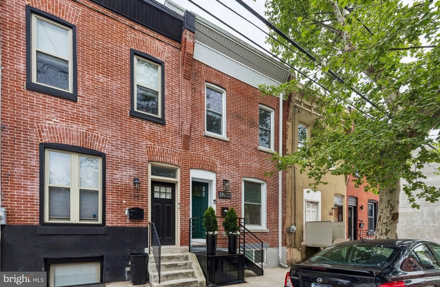 Welcome to 1755 N 26th St — a stunning, fully renovated home tucked away on a quiet block in Brewerytown, one of Philadelphia’s most vibrant and fastest-growing neighborhoods. This 4-bedroom, 4.5-bath residence seamlessly blends modern comfort with timeless character, featuring custom wood beams, exposed brick, and thoughtfully curated design details throughout. The open main level offers a bright, spacious living area that flows effortlessly into the dining space and into a beautifully designed kitchen complete with custom cabinetry, upgraded appliances, and striking countertops. A conveniently located half bath completes this level. Upstairs, the second floor features two generously sized bedrooms and two fully updated, stylish bathrooms, along with a conveniently located laundry area. The third-floor primary suite serves as a true retreat, boasting a massive bedroom, an oversized walk-in closet, and a private en-suite bathroom. The fully finished basement provides incredible flexibility for additional living space, whether you envision a media room, home office, gym, or recreation area. Ideally located just 10 minutes from the Philadelphia Zoo and Art Museum, a short six-block walk to Girard Avenue, and only 15 minutes to Center City, this home offers both convenience and lifestyle. This is a rare opportunity to own a high-quality renovation in one of Philadelphia’s most sought-after communities. Take advantage of an active and approved tax-abatement until 2030.