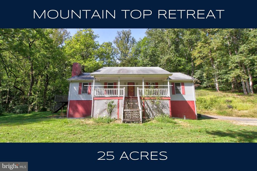 Escape to peace and privacy with this 25 acre mountain retreat in scenic Rappahannock County. Nestled along the Racer Run and surrounded by untouched virgin forest, this property offers a rare opportunity to enjoy nature at its finest. With abundant wildlife, towering trees, and complete seclusion, it’s a true sanctuary just minutes from the charming towns of Washington and Sperryville.

Built in 1992, the three-bedroom, two-bath rambler features an inviting living room with vaulted ceilings and a striking stone fireplace as its centerpiece. The spacious formal dining room is filled with natural light from multiple windows, while the eat-in kitchen provides space for a breakfast table beneath three large windows overlooking the woods. A covered front porch and expansive wraparound deck—complete with both stairs and a ramp—create the perfect setting for taking in the quiet mountain surroundings.

The main level also includes a laundry area for added convenience. A full, unfinished walk-out basement with windows and sliding glass doors provides exceptional potential for future living space or storage.

Located on Gid Brown Hollow Road, a quiet paved county-maintained road, this property combines tranquility with accessibility. Just a short drive from the Inn at Little Washington, Shenandoah National Park, local wineries, and hiking trails like Old Rag and White Oak Canyon, this is an ideal place to enjoy Rappahannock’s beauty and lifestyle.