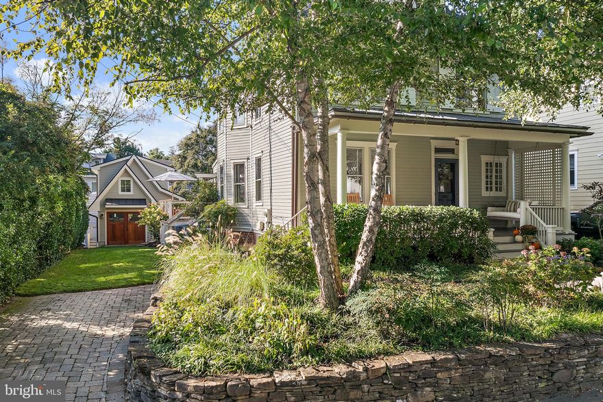 This beautifully restored 1913 home, located in the coveted water block of Murray Hill, seamlessly blends historic character with classic  design, creating an inviting space for everyday living and entertaining. A charming front porch welcomes you into an elegant entrance hall, setting the tone for the craftsmanship found throughout the home. Inside, 9 ft ceilings, heart pine floors, oversized pocket doors, and a split staircase with wainscoting highlight the home’s timeless charm.
Boasting over 4,000 sq. ft. of living space, the home is designed for effortless flow. The light-filled family rooms and kitchen connect seamlessly to a sophisticated white kitchen, complete with marble countertops, open shelving, and a built-in bar—perfect for gatherings. Step out onto the expansive wraparound IPE deck and fenced backyard, for seamless indoor-outdoor living.  
The third floor has been transformed into a private primary suite featuring custom built-ins, a full marble bath, laundry, and  glimpses of Spa Creek. The main house offers 4 bedrooms and 4.5 baths, including a spacious lower-level recreation room with a full bath.
A standout feature is the recently constructed detached two-story “Casita,” offering a guest bedroom, 2 baths (one with an outdoor shower), and a flexible first-floor space ideal for a gym or office—perfect for hosting visitors or creating your own retreat.
Additional upgrades include a new roof, irrigation system and a new sewer line. With a parking pad for two cars and a premier location just four blocks from Church Circle, this home is steps from Annapolis’ finest shops, dining, and cultural experiences.