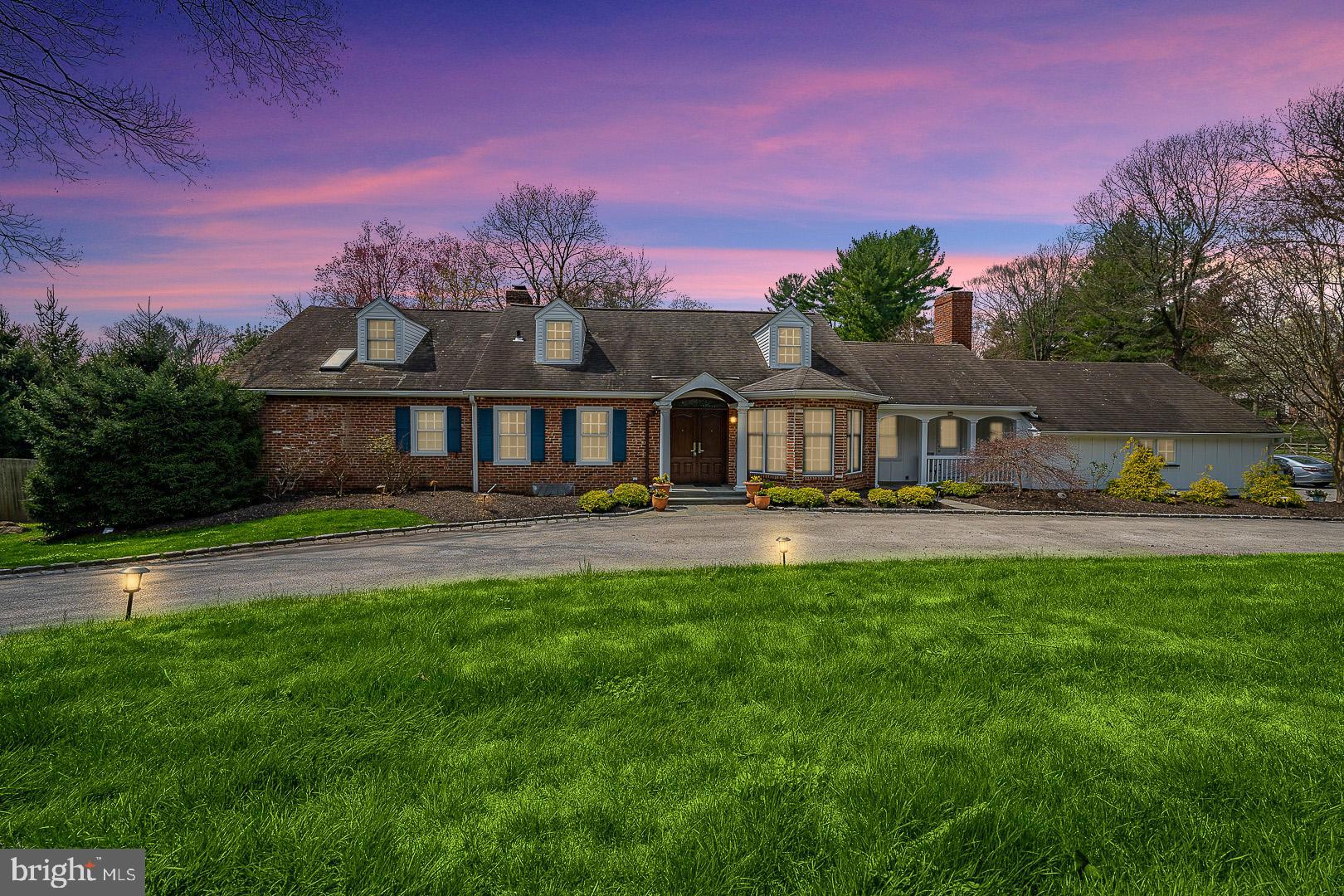 Wonderful, 5 bedroom, 4 and a half bath, 4,997 sq ft Villanova home sitting on 1.09 acres awaits! Double doors open to the 2-story foyer where you will immediately notice the beautiful details and hardwood floors that flow throughout the home. The formal dining room to the right has a lovely bay window and an elegant built-in cabinet. The formal living room features a fireplace with built-in bookcases, hardwood floors, and plenty of light. From here, enter the spacious gourmet kitchen with a large island, granite countertops, stainless steel appliances, tons of cabinet space, a pantry, and a breakfast area with sliders to a slate patio. The fabulous family room, with a vaulted ceiling, exposed beams, fireplace, and skylights, is flooded with natural light and sits conveniently off the kitchen. French doors open to a slate patio with stunning views of the expansive backyard, gorgeous pool and stunning sunsets. The 1st floor primary suite, with a private deck overlooking the grounds, gas fireplace, built-in armoires, walk-in closet, and full en-suite bath with soaking tub and oversized marble shower, is the perfect retreat. A bonus room (can be used as an extra bedroom, nursery, or office space), mudroom, laundry, and half bath complete this level. Upstairs, you will find 3 additional bedrooms, one with a full en-suite bath and 2 walk-in closets, and a full hall bath. The finished walk-out lower level spans the entire footprint of the house and has a wet bar and full bath is perfect for a rec/playroom or in-law suite and offers access to the backyard and pool area. The lush, manicured level yard is your own private oasis with its quiet patio for enjoying your morning coffee, and a 9ft deep swimming pool for cooling off on a hot summer's day. 2-Car garage and a circular driveway offer plenty of parking space. Full house Generator, new water heater, new washer and dryer, new dishwasher, and water softener. It is located in the Award Winning Lower Merion School District. Easy access to train stations and major roadways, including 476 and 76. This property is a must see!