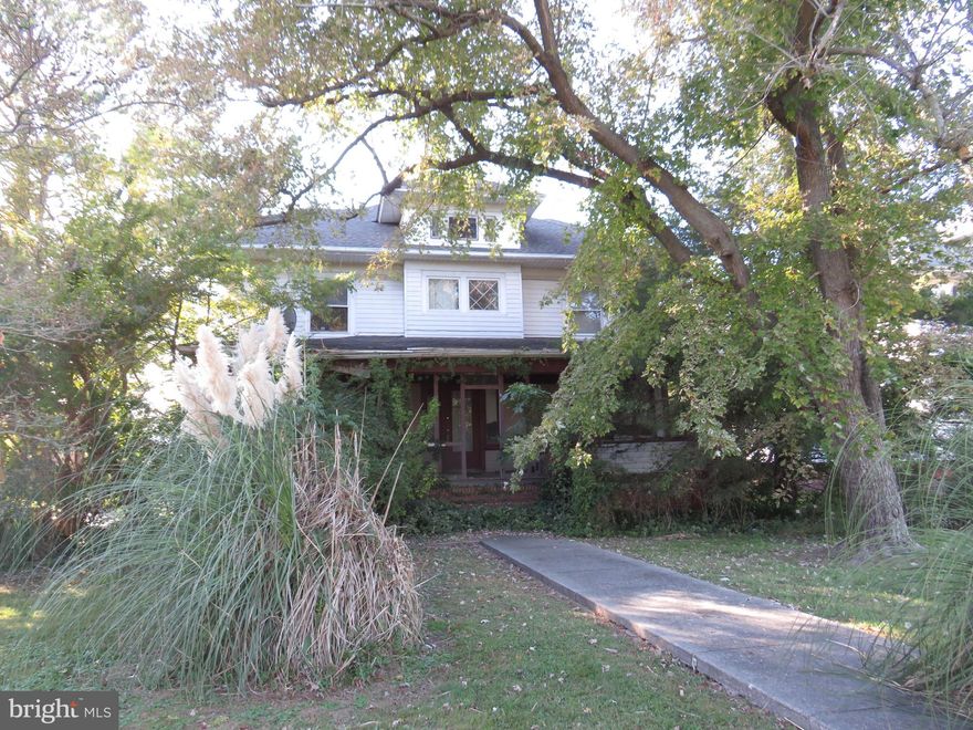This home was the "belle of the block".  Classic four square Craftsman style home with leaded top sash windows, huge front porch, large dining room and living room and a full first floor bath.  The second floor has four large bedrooms, a sitting area in the hall, and a large full bath.  There is a walkup full floored attic.  The house needs much work to bring it back to it's former glory.  The dining room and hall flooring has been replaced with subfloor.  The living room and breakfast room have original hardwood floors, as do the bedrooms on the second floor. There is a large lot that extends to the carwash lot.  Conveniently located near the high school and shopping areas.  This is a cash only "as is" sale.  Owner will be removing furniture items from the home.