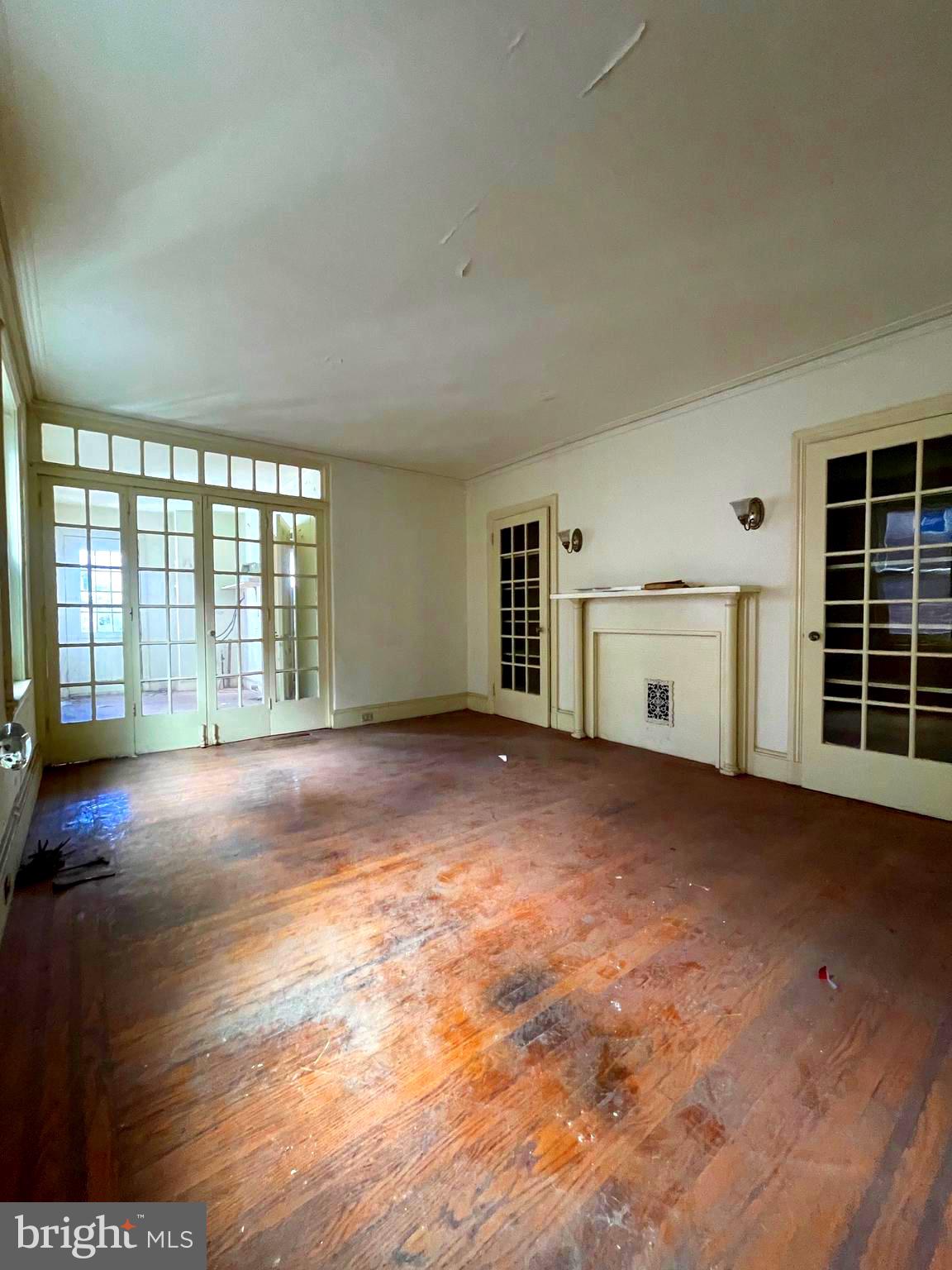 Location Location Location!!! Welcome to this 20’ wide, 90’ deep SHOVEL READY, FULLY APPROVED & PERMITTED Brownstone development on Doctor’s Row in JuNoGi (Just North Of Girard). This building has been lived in for over 100 years by the same family and now it is ready for you to build a lasting Trophy Investment. This is the best possible time to put this asset in your portfolio. Zoning & Building Permits in hand for a 3 unit new condos / apartments, all with private outdoor space. This building's bones are incredible. Architectural elements are in place. Multiple Fireplaces. Incredible marble entry foyer. Grand winding staircase. Every window is Brand New and installed. Ready for you and your crew to finish the interior renovation & make this investment return BIG!