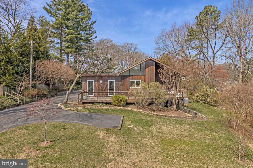 Not to be missed! Gorgeous cedar midcentury modern home with covered slate porch and walnut double-door entrance that brings you into the bright and welcoming foyer. This sophisticated, yet character-filled home, on .4 acres, offers over 4,200 finished sq ft of comfortable living space across two levels, plus an expansive, easily accessible attic with 800+ sq ft for incredible storage possibilities and future potential. The open-concept main level features hardwood floors throughout. Natural light floods the space, maximized by oversized windows in the spacious family room and a vaulted kitchen ceiling. The family room is both cozy and functional, featuring a gas fireplace, custom built-ins, and direct access to the mahogany-plank front deck. This level has three bedrooms and two full baths, including the primary bedroom with a walk-in closet and ensuite bath. A sun-filled home office and a separate dining room complete the main floor.

A custom glass-paneled staircase leads to the fully-finished, walk-out lower level, with nearly 2,000 finished sq ft. This level offers a great option for multi-generational living, or as an au-pair or in-law suite, featuring a guest bedroom with an ensuite full bath and walk-in closet, two spacious recreation areas - the large game room easily accommodates a full billiards table and game day viewing set-up, adjacent to a second family room, music studio or playroom, as well as a dedicated workout room that conveys with high-quality gym equipment. A laundry room, second full bath and ample storage complete this level.

Enjoy the privacy of the fenced-in backyard and the convenience of the oversized detached garage. Big enough for four cars, with two double doors and an additional pedestrian door, the garage includes a fast level 2 EV car charging outlet and offers plenty of additional space for storage, bikes, lawn equipment, a studio, or a workshop. Finally, enjoy peace of mind with the whole house generator (with all new electrical updates in February 2026). Public water and public sewer. Ideally located well inside the beltway, just minutes to downtown McLean and Tysons Corner, as well as major commuter access to Chain Bridge and GW Parkway.