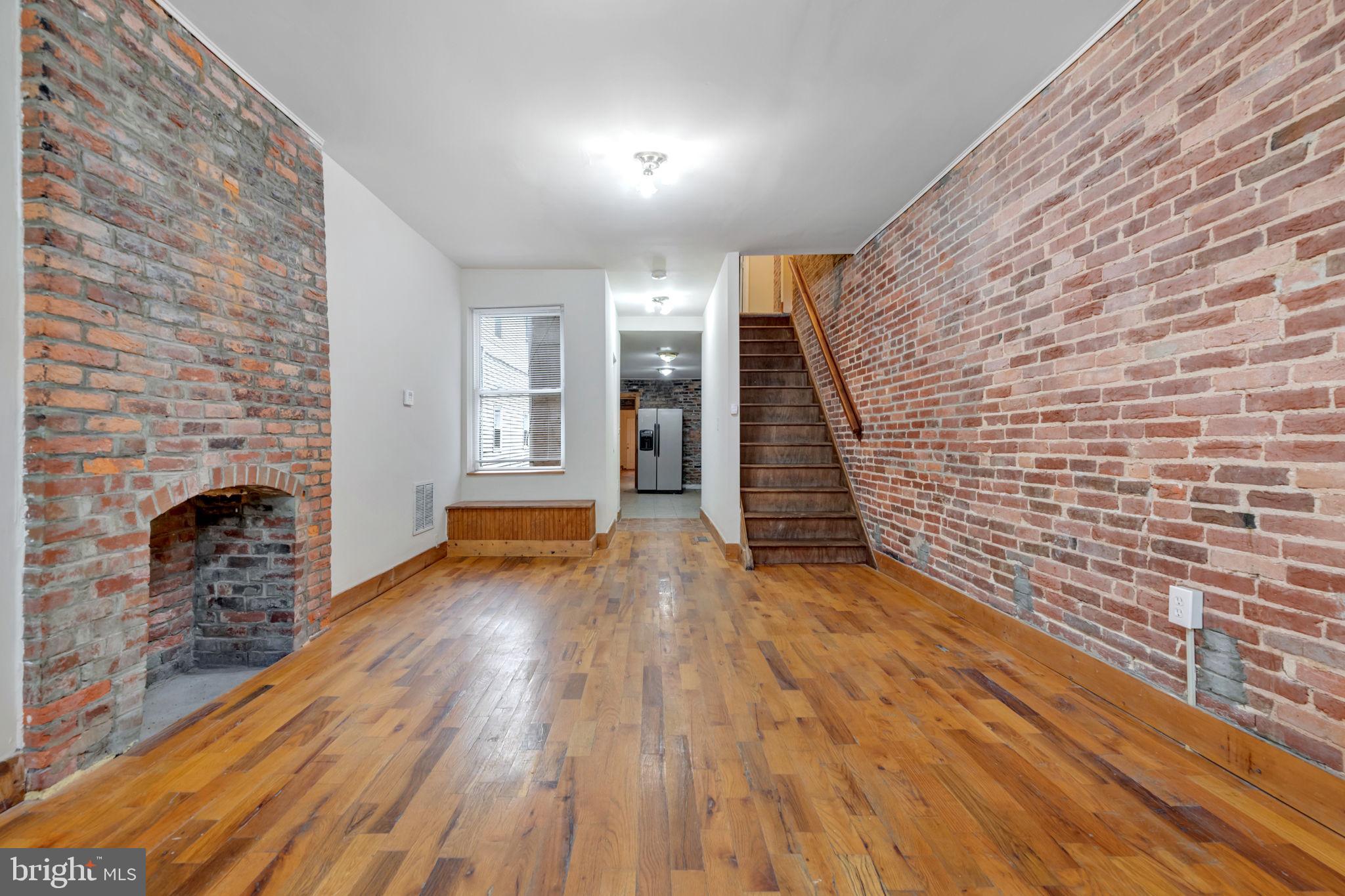 Discover this spacious three-story Baltimore townhouse ideally situated just steps from Broadway and a short stroll to the vibrant heart of Fells Point. Enjoy the convenience of walking distance to Johns Hopkins Hospital and Patterson Park. This home features 3 bedrooms, 3 bathrooms, a home office/workspace room, new carpeting upstairs, a gas oven, washer and dryer, and charming exposed brick accents. Don't miss out on this rare opportunity! Ideal for those seeking the perfect blend of location, space, and character