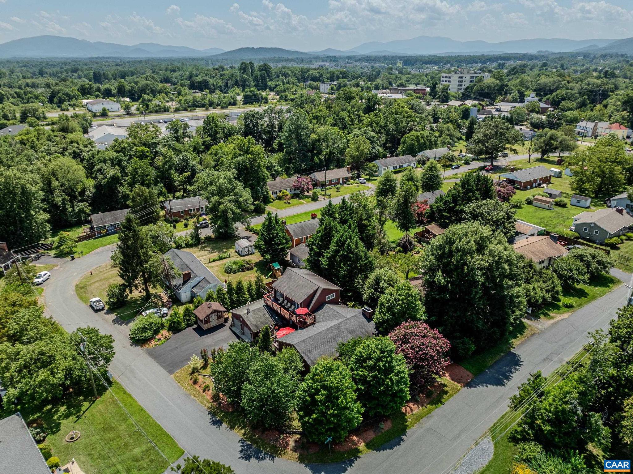 This home is a hidden gem in the heart of Crozet! Luxurious, private outdoor living spaces, upgraded kitchen and spa-like primary bathroom make this a must-see home walkable to Downtown Crozet shops and restaurants. You'll love the solid hardwood flooring with cherry finish throughout the home. The formal living room features a grand floor-to ceiling stone fireplace as a focal point, and also includes a separate media area. The gourmet kitchen features granite counters, custom cabinetry, a striking copper double bowl sink, stainless appliances and a generous island with a built-in grill. The kitchen opens to a spacious dining room that is great for entertaining. The main level features three additional bedrooms and a full bathroom. The second floor features a secluded primary suite with two spacious walk-in closets, and ensuite bathroom boasting a freestanding soaking tub and stunning walk-in shower. Enjoy a morning cup of coffee on the private roof-top deck. The outdoor living spaces at this home stun with over 1500 sqft of private patios and decks! With an unfinished basement, storage shed/workshop, and two car detached garage this home is truly a gem! Current owners have rented as AirBnB. Ask agent for details.,Glass Front Cabinets,Granite Counter,Painted Cabinets,Wood Cabinets,Fireplace in Living Room