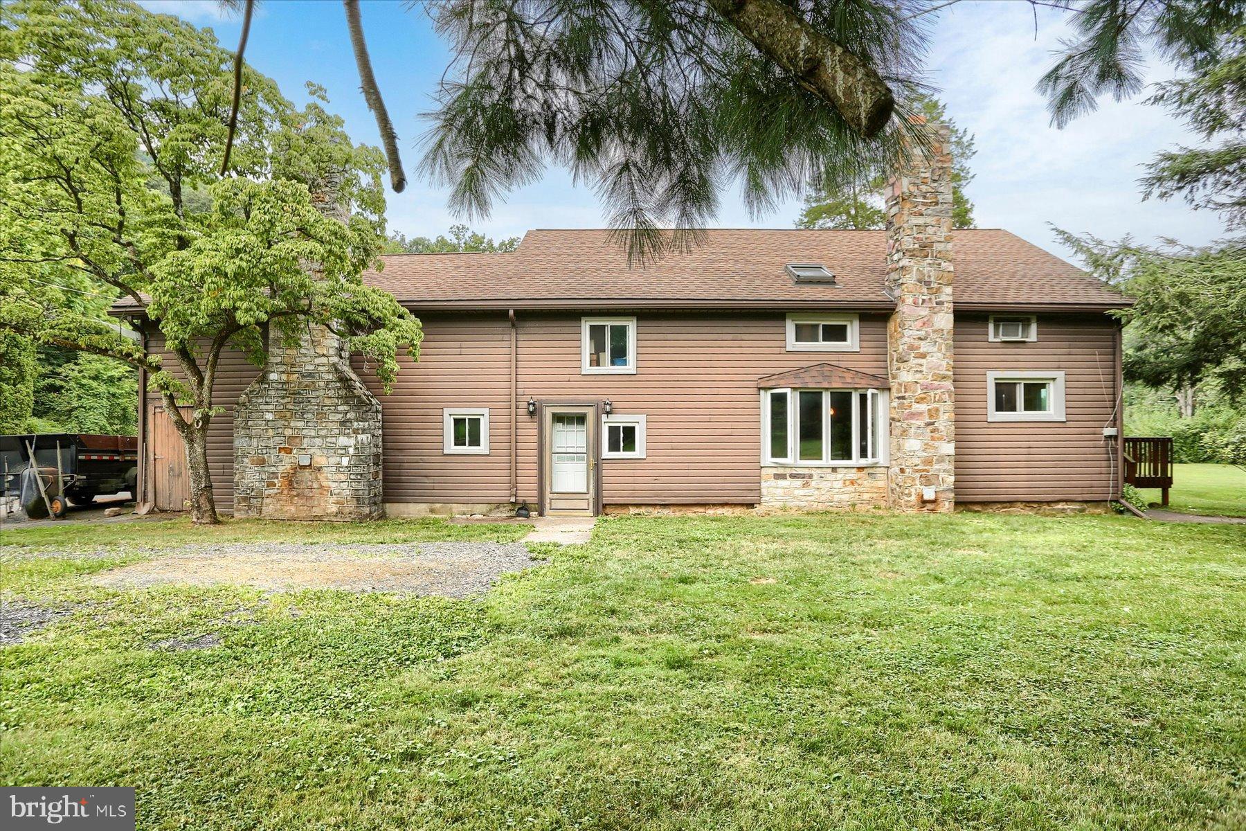 This property is going to onsite auction 10/4/2025 at 12:00 PM and is being sold with reserve. LISTED PRICE IS ONLY A SUGGESTED OPENING BID AND IS NOT INDICATIVE OF THE FINAL SALES PRICE WHICH WILL BE BY SELLER CONFIRMATION DAY OF AUCTION. Terms: Down payment of $25,000 required day of auction. Settlement on or before 12/4/2025. Transfer taxes to be paid by buyer. Real Estate taxes shall be prorated........Discover this 3-bedroom, 1.5-bath home with an attached 2-car garage set on 32.79 acres in scenic Perry County, near a beautiful lake and surrounded by abundant outdoor recreation. Formerly a barn, the home showcases rustic charm with exposed beams, unique stone floors, and two distinctive stone fireplaces. A spacious deck provides the perfect spot to relax and take in the peaceful surroundings. With over 3,400 sq ft under roof—1,510 sq ft finished—there’s plenty of opportunity to customize and expand to your taste.
The property features 7 acres of tillable ground ideal for pasture, gardening, or wildlife food plots, plus 23 wooded acres for hunting, hiking, or exploring. The southern boundary follows Laurel Run for 1,400 feet, a native brook trout stream perfect for fishing or relaxing by the water. Adding to its character, the land includes a historic stone structure and well from its past as a campground. Conveniently located near Colonel Denning State Park and Tuscarora State Forest, this property offers the perfect blend of privacy, recreation, and potential.