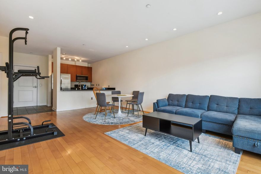 Welcome to your dream urban retreat in the lively, sought-after neighborhood of Woodberry! This exquisite penthouse condo offers a perfect blend of modern luxury and unparalleled convenience, nestled in a community brimming with vibrant energy and charm. As you step inside, you're greeted by an expansive living space flooded with natural light, showcasing newly refinished floors that combine durability with sophistication.  The sleek, fully equipped kitchen features top-of-the-line stainless steel appliances, including a refrigerator, stove, dishwasher, and microwave — for an effortlessly smooth cooking experience. Plus, enjoy the added luxury of newly upgraded toilets throughout the unit, ensuring both style and comfort. Relax and unwind in your serene primary bedroom, complete with a cutting-edge closet system that optimizes space and organization, making your daily routine both efficient and elevated. Positioned right in the heart of Woodberry, this condo is in very close proximity to chic cafes, eclectic boutiques, and an array of entertainment options. With a gated, covered parking spot (P-13) and quick access to public transportation, the light rail, and major highways, getting around is a breeze. Plus, you're just moments from the natural beauty of Druid Hill Park and the tranquil Zen Garden — perfect for unwinding amidst nature. Live where convenience meets luxury, and experience the very best of urban living. This is more than just a home; it's a lifestyle!