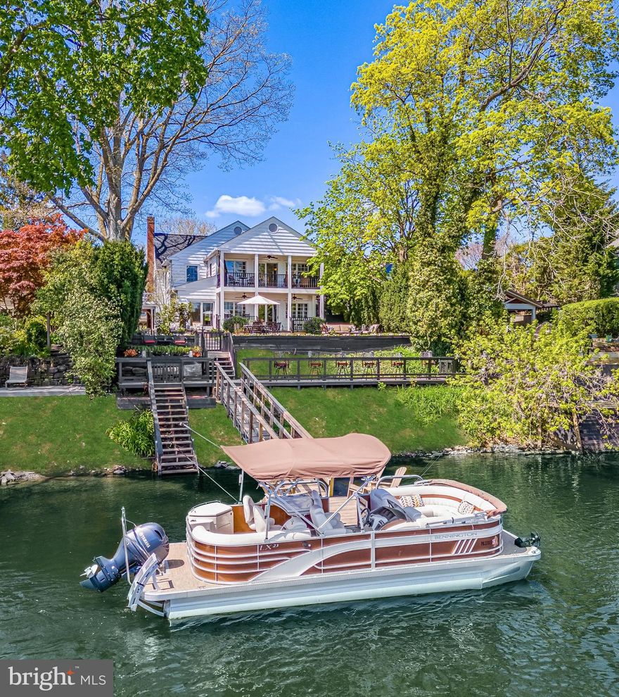 Welcome to 64 N Main Street, an ultra luxury waterfront estate, privately nested on the Delaware River in New Hope, Pennsylvania. This is a rare opportunity to own a world class waterfront estate in the heart of New Hope. This residence combines timeless craftsmanship, modern sophistication, and the serenity of the Delaware River. With four bedrooms, 3.5 baths, an office, and over 3300 square feet of living space this, exquisite residence offers a lifestyle of unmatched refinement, complete with the private boat dock for effortless riverfront living. Step inside to discover interiors adorned with hardwood floors, custom moldings, and Wainscoting, blending classic architecture with contemporary design. Every detail is intentional with custom lighting, motorized shades with designer drapery, and built-ins that add both elegance and function. The living room offers warmth and grandeur, with a fireplace flanked by bespoke built-ins.  An eye-catching mantle creates a truly warm gathering space. A dedicated office with custom cabinetry and built-ins provides a refined and productive environment perfect for today's lifestyle.  A gourmet chef’s kitchen is anchored with a 48-inch Wolf dual fuel range and Sub-Zero refrigerator with handcrafted natural colored mahogany cabinetry, soapstone countertops, and a hand carved sink. Open and inviting, the kitchen flows seamlessly into a sunlit dining and entertaining space with expansive windows framing uninterrupted shimmering river view. Let us not forget the butler’s pantry which includes a wet bar, and another subzero refrigerator adorned with Mercer tiles. The family room is inviting, light filled and perfect for entertaining as it flows seamlessly from the dining and formal living areas (not to mention the breathtaking views of the Delaware river). Travel outdoors to the impressive, covered porch and patio with lush gardens and pathway to the panoramic bar and dock. 
 On the second floor, the primary suite is a retreat of rare indulgence featuring cathedral ceilings, a private balcony overlooking the Delaware, a morning coffee bar and a boutique style dressing room with make-up station. The spa inspired bath is finished in Calcutta gold marble, a stone jetted soaking tub, custom stone inclined double sinks, and Robern Uplift Medicine cabinets.  A Brizo sensory shower system rivals the finest resorts.  Two additional charming bedrooms, a full bathroom, and a private bedroom suite with a full bathroom complete the second level sanctuary. 
 Multiple terraces and private covered patio garden retreat create a tranquil space for both entertaining and peaceful reflection. Landscaped pathways lead to a private dock offering direct access to the river for boating, kayaking, paddle boarding or sunset cruises. This property is more than a home, it is a statement of elegance, privilege and lifestyle, offering unrivaled riverfront living just moments from boutiques, galleries and fine dining of New Hope and Lambertville.