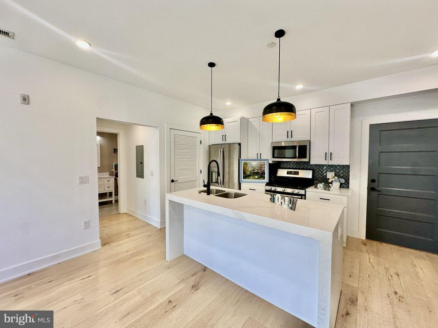 Welcome to this stunning 2-bedroom, 2-bathroom residence offering modern luxury living in the heart of Fishtown, ideally situated above the highly sought-after Middle Child Clubhouse.
This sun-drenched home features a spacious open-concept layout with beautiful hardwood flooring throughout and oversized windows that fill the space with natural light. The chef’s kitchen is designed to impress, complete with stainless steel appliances, a gas range, quartz countertops, a stylish tile backsplash, and a center island with counter seating — perfect for both everyday living and entertaining.
Thoughtfully designed for privacy, the two generously sized bedrooms are positioned on opposite sides of the unit. The primary suite offers a walk-in closet and a beautifully appointed ensuite bathroom, creating a comfortable and private retreat. A second full bathroom, finished with elegant marble tile, is conveniently located in the hallway. All furnitures in the living room and bedrooms are virtually staged for illustration purposes.
Additional highlights include in-unit washer and dryer, key-coded secure entry, dedicated mail and package storage, basement bike storage, and trash and recycling chutes on each floor for added convenience.
Optional off-site parking is available just two blocks away at 1400 N Howard St for approximately $250/month (subject to availability).
Located in one of Philadelphia’s most vibrant neighborhoods, you are just steps from top-rated restaurants, cafes, nightlife, and easy public transportation — offering the ultimate urban lifestyle.
This exceptional home offers a rare opportunity to enjoy stylish city living in a prime location, with approximately four years remaining on the tax abatement.
As you tour the home, take in the exceptional artwork by local artist Alex Li. These pieces are available for purchase—inviting you to bring a touch of the home’s unique artistic character into your own life!