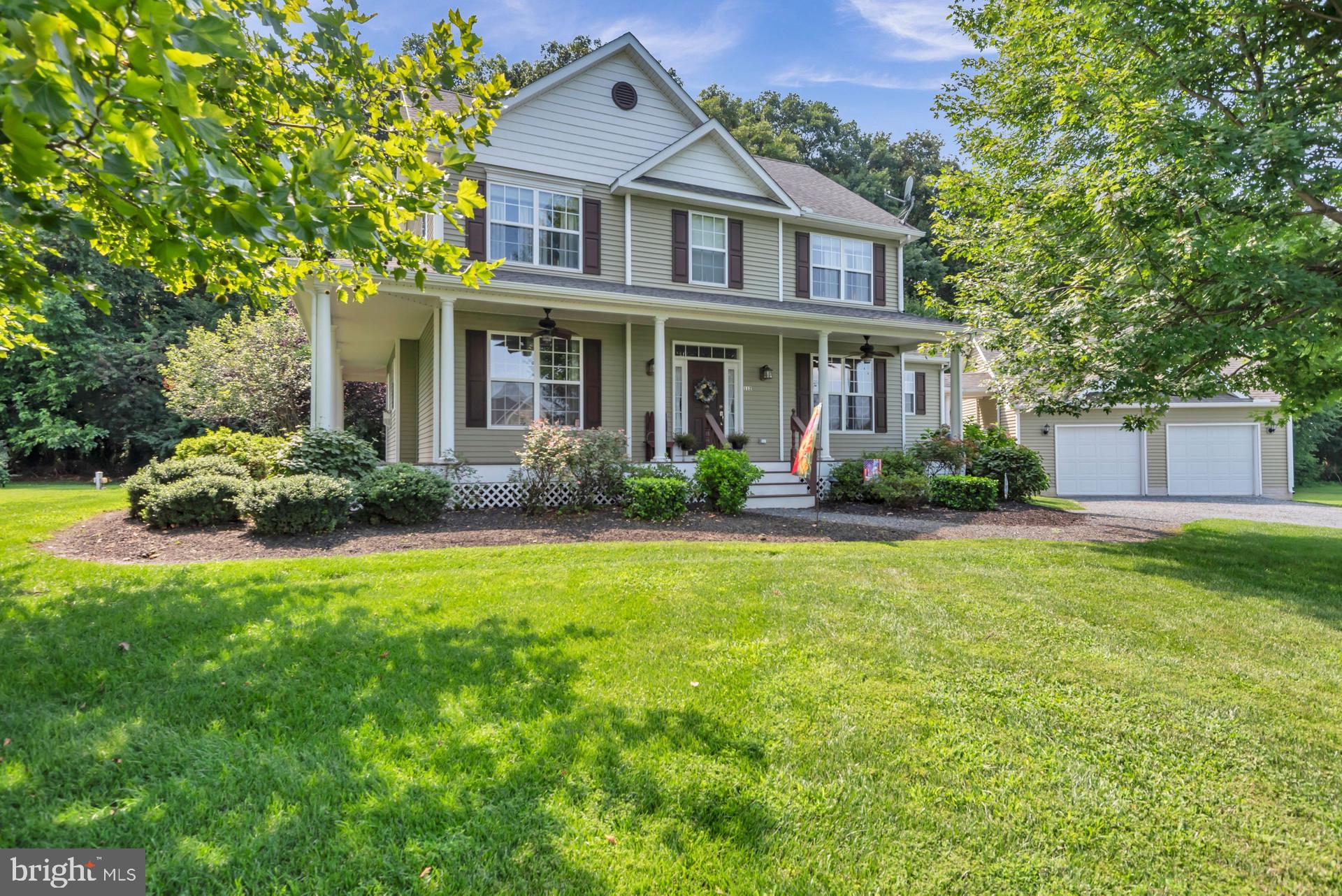 New Listing! Stunning Colonial on 1.13 acres with Gorgeous Wrap Around Covered Front Porch and Breezeway leading to Detached 2 Car Garage on Private Lot Backing to Trees with Full, Unfinished Basement. This 4 Bedroom, 2.5 Bath home features 2376 sf on the Main and Upper levels and an additional 1356 sf Basement with Walk-Up and Out Exit Rarely Found on the Eastern Shore. This Home is Jam Packed with Quality Features to Include Newly Refinished Hardwood Flooring, Propane Gas Fireplace, Granite Counters. You'll love the Gourmet Style Kitchen with Island featuring Propane Gas Cooktop and Separate Wall Oven with Built-in Microwave Above and an incredible 5' x 5' walk in pantry. Adjoining the Kitchen is a Sunny Rear Breakfast Room with Exit to a Relaxing Covered Rear Deck and Steps Down to a Paver Patio Area. There is a Large Family Room with Propane Gas Fireplace with Built-In's and Large Sliding Glass Doors that Lead to the Back Covered Deck. Upper Level has an Expansive Primary with Walk-In Closet and Adjoining Full Bath w Double Sinks, Renovated Shower Stall and Separate Tub + 3 Additional Spare Bedrooms Each with Ceiling Fans and Generously Sized. The Detached Garage is a Car Lover's Dream with Additional Storage Room and Mini-Split. This Home Features Well Water with Owned Water Softener, Private Septic, Geothermal Heating, Central A/C and a Rinnai Tankless Water Heater. This is a Well Maintained, Quality Home! Call helpful lister with any questions.