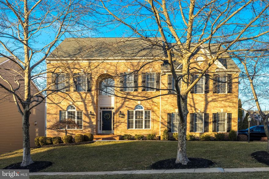 Beautiful brick-front Colonial in the sought-after Lansdowne on the Potomac community combines the best of timeless design, modern updates, and peaceful outdoor living on a quarter-acre lot. Enjoy grand interior proportions and versatile living spaces, plus a recently finished lower level, all just moments from Lansdowne Town Center, top-rated schools, and neighborhood parks. Arrive into the double-height foyer, with hardwood floors leading to formal living and dining rooms ideal for both hosting and everyday relaxation. At the heart of the home, the open-concept kitchen flows into a light and airy two-story family room, where cathedral ceilings soar above large windows and a cozy fireplace. The gourmet kitchen is designed for gathering, featuring a large granite-topped bar, updated stainless steel appliances and tile back splash, abundant cabinet storage, as well as a walk-in pantry. A breakfast nook opens directly to the deck through an updated Pella triple sliding door crafted to resemble French doors to align with the community’s design. The main level also includes a private home office, a powder room, and a laundry room with upgraded front-loaders. Outdoor living is easy with a deck just off the main living areas, and a fenced backyard perfect for pets and play. Upstairs, the primary suite is a private retreat with vaulted ceilings, a spacious sitting area, and a large walk-in closet. The en suite primary bath features a corner soaking tub, double vanity, and shower with dual heads. A junior suite with its own private bath and two additional bedrooms connected by a Jack-and-Jill bathroom are also on this level. The walk-up lower level, finished in 2023, expands your living space with a large den and rec room that opens to the backyard. Two versatile bonus rooms and a chic remodeled en suite bath with oversized shower offer endless possibilities for guests, a home theater, gym and more. Unfinished storage/utility areas add convenience. The upgraded two-car sideload garage features epoxy floors, updated doors and openers (2022), and connects to a driveway repaved in 2021. Additional recent updates include new HVAC (2019), kitchen appliances (2019), garbage disposal (2023), front walkway (2024), and more. Lansdowne on the Potomac is known for its exceptional amenities, including indoor/outdoor pools, fitness facilities, sport courts, playgrounds, meeting spaces, and more. Nearby Route 7 provides easy access to shopping and dining at Lansdowne Town Center, golf courses, hiking trails along the Potomac River at Elizabeth Mills Riverfront Park, and Lansdowne Resort & Spa. With its thoughtful layout, modern updates, and prime location in one of Loudoun County’s most celebrated communities, this one has it all!