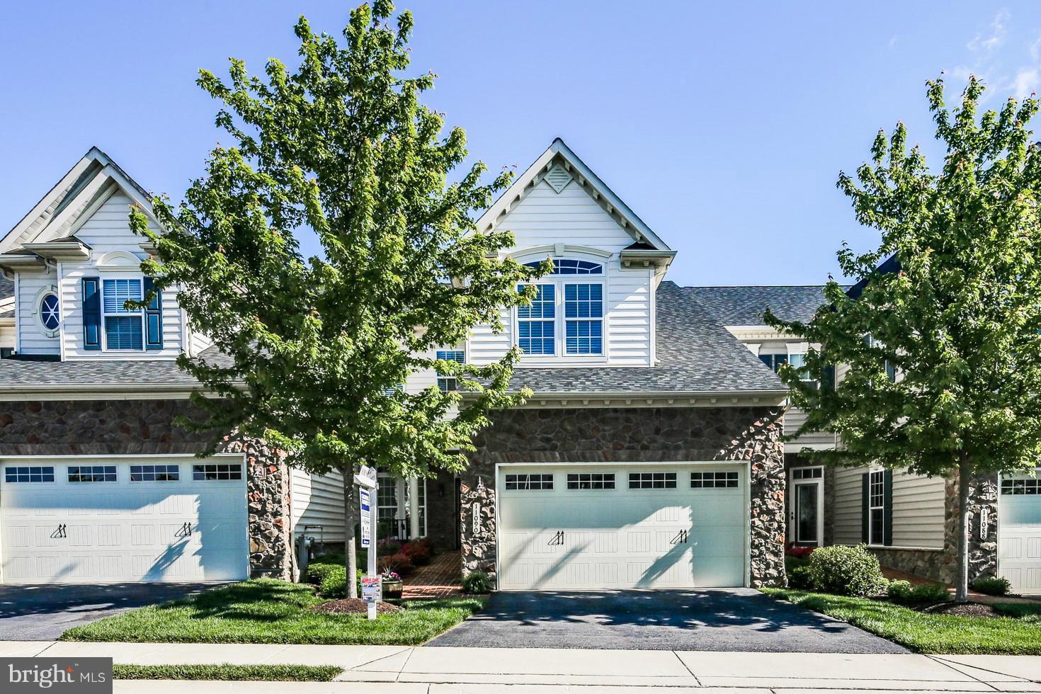 Exquisite Villa with a spectacular view overlooking the golf course & wooded vista in a premier Active Adult community*Top of the line upgrades*Gleaming hardwood floors*Gourmet kitchen w/center island,granite & stainless appliances*Main level MBR with a luxury bath*Fabulous sunroom leading to the deck*Finished walkout lower level w/gas FP,custom built-ins & impressive entertainment bar*An A plus!