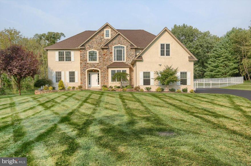 Better Than New Construction! Welcome to this well maintained and recently upgraded Magnificent Stone & Stucco Estate Home on 2.90 acres in Prestigious Skippack Township. First floor features include: hardwood flooring, coffered ceilings, extensive mill work throughout, center hall 2-story foyer with sweeping staircase and balcony, formal living room and dining room with wainscoting. The 1st floor study with full bath could be an in-law or Au Pair suite or a 5th bedroom. Entertain in the 2 story great room with floor-to-ceiling windows, built in bookcases, propane stone floor to ceiling fireplace and recessed lighting. Prepping is made easy and fun in the gourmet granite kitchen with custom cabinetry and large center island, morning room, butler's pantry. The second floor features a luxurious master suite & bath including soaking tub, walk-in rainforest shower and an enormous walk-in closet. The 2nd floor also offers a spacious princess suite, a Jack & Jill suite, laundry room and linen closets. Extend your entertaining to the large private backyard patio and in ground pool situated on this secluded lot surrounded by trees. If you need additional space, the full-length basement with egress window is a blank canvas ready for your finishing touches. Recent updates include Newer Hardwood floors, HVAC, Driveway, Fencing, Land Clearing, Generator, and more (see list of over $230K in recent improvements). Side-entrance three car garage, long private driveway, zoned HVAC, Andersen windows, and peaceful, relaxing, private views! This is the one you’ve been waiting for!!