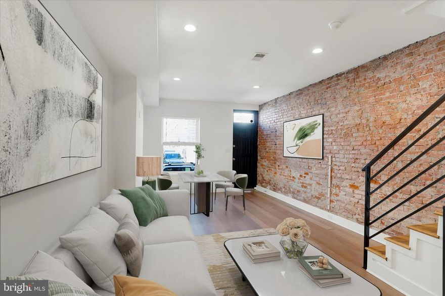 Fully Renovated Philadelphia Rowhome in the heart of Grays Ferry! Welcome to your new home on a beautifully maintained block surrounded by new construction and renovated rowhomes in the popular Grays Ferry neighborhood of Philadelphia. This move-in ready home perfectly blends timeless character with modern design, offering comfort, style, and convenience in one incredible package. The classic brick exterior, modern black window frames, and sleek metal railings set the tone for what’s inside. Step through the front door and you’ll be greeted by warm hardwood floors, exposed original brick walls, and a bright open-concept layout that combines the living and dining areas, ideal for entertaining or everyday living. The updated modern kitchen features durable quartz countertops, soft-close cabinetry, a clean white subway tile backsplash, and stainless steel appliances. From the kitchen, step out to your private fenced-in patio and yard—your very own city oasis, perfect for morning coffee, outdoor dining, or evening cocktails. Upstairs, you’ll find three spacious bedrooms, each with generous closet space, more exposed brick accents, and stylish modern light fixtures. The full bathroom showcases designer touches including floor-to-ceiling subway tile, penny tile flooring, and a sleek vanity. The finished basement adds even more living space, ideal for a family room, home gym, or guest suite, and includes a second full bathroom. Recent upgrades include fresh paint throughout, making this home completely turnkey. Conveniently located near University City, CHOP, University of Pennsylvania, and Jefferson Hospital, with easy access to public transportation and I-76, this home puts you close to everything Philadelphia has to offer: shopping, dining, and vibrant neighborhood life. Don’t miss your chance to own this beautifully renovated rowhome in Grays Ferry. Schedule your private showing today!