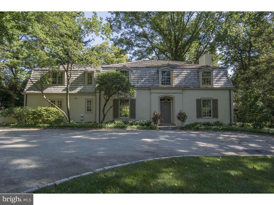 Set atop a slight rise and accessed by a wide, semi-circular driveway dotted with specimen, centennial trees, find this classically style 4-5 bedroom, 4 1/2 bath French colonial home on a spectacular 1.5 acre double parcel. Enter through a four panel door to a transverse Foyer with richly stained hardwood floors showcasing an open floor plan and connection to the Living Room, Dining Room and Den. Bathed in natural light, the formal Living Room features a wood burning fireplace with glazed tile surround and a full wall of windows and french doors leading to the blue stone Terrace, Pergola and beyond to beautifully proportioned Pool with slate coping. To the right of foyer is a handsome Den highlighted by corner wood burning fireplace and custom display and storage shelving offering requisite space for relaxing, working or informal gathering. Graced by a floor to ceiling bay windows flanked by French doors, the spacious Dining Room is positioned to enjoy a southern exposure and access to the Rear Terrace making it ideal for both formal indoor or al fresco entertaining. A service door leads to a large eat-in Kitchen. Generous flat prep space and warm toned solid wood cabinetry combine to create both a functional as well as inviting Kitchen and Breakfast Area, steps away from the rear stair, Mudroom and two car attached Garage. Second Level features a large bright Master Bedroom with His and Her Baths and outfitted, walk-in closet. This deluxe retreat space opens to a deep detailed wrought iron Balcony overlooking the rear yard and pool. A semi-circular metal stair gives private connection from the master balcony to the terracing below . Three Family or Guest Bedrooms connect to two full Baths while the fourth Bedroom is currently in use as an office with excellent light and convenient proximity to the Master Suite. Lower level is offered as primary storage and Laundry Room. A second fully subdivided and buildable parcel is included in this sale.  Tax I.D. # 40-00-42240-01-1