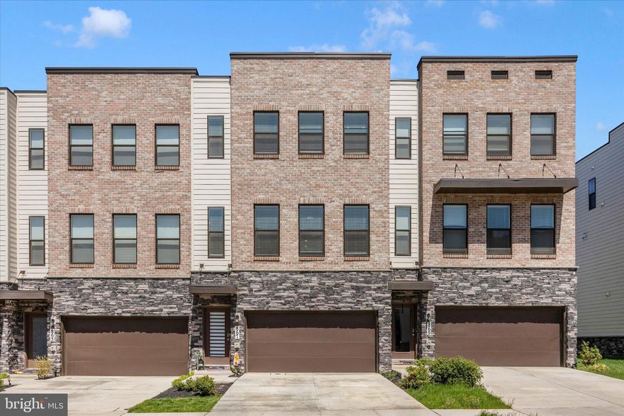 Why wait for new construction when you can get so much more with this almost new and sure to please the most impeccable taste with all the upgrades and aftermarket options already done! *** Step into a home that feels as good as it looks—this beautifully upgraded 4-bedroom, 3.5-bath residence, built in 2023, has been gently lived in and thoughtfully enhanced with over $50,000 in upgrades added After 2023 that elevate both comfort and style. *** From the moment you arrive, you’ll sense the care and attention that make this home truly special. ***
The welcoming foyer sets the tone with a stylish wall accent with a charming ledge and convenient hooks creating a space that’s both functional and welcoming—perfect for everyday living or seasonal decor. ***
Rich luxury vinyl plank flooring creates a seamless, modern flow through the living room, dining area, kitchen and cozy sitting area. ***
The sun-filled living room features crown molding, a designer accent wall, ceiling fan, and three large windows that bring in abundant natural light. ***
The kitchen is truly the heart of the home, designed to bring people together. With crisp white cabinetry, stainless steel appliances, quartzite countertops, and a spacious island highlighted by a stunning stone accent, it’s as functional as it is beautiful. Whether gathering around the dining area or relaxing in the adjacent sitting space with its full-wall accent, there’s room for everyone to feel at home.  ***
Step outside to your Trex deck with added solar light caps that overlooks a fully privacy-fenced backyard.  A graceful spiral staircase leads to a large concrete patio below—ideal for entertaining, grilling, or simply unwinding in your own outdoor retreat.  ***
Upstairs, a decorative accent wall at the landing leads you to the spacious and peaceful primary suite, complete with a ceiling fan, a walk-in closet with custom built-ins, and a full ensuite featuring tile flooring, a tiled shower surround, double bowl vanity, and a private water closet. Two additional bedrooms, a full bath, and a conveniently located laundry room complete this level.  ***
And there’s even more to love on the lower level. In addition to the epoxy-coated garage floor that enhances style, functionality and durability, you’ll find a versatile space with upgraded flooring and is perfect as a fourth bedroom, home office, workout area, or family room—along with a full bathroom featuring a beautifully upgraded tile floor. Sliding glass doors provide easy access to the backyard, patio, and deck, seamlessly blending indoor and outdoor living.  ***
Numerous upgrades include the privacy fence, large patio, spiral staircase from the deck to the patio, upgraded paint throughout, upgraded light fixtures, decorative wood design accent walls, stone accent wall at the bar, upgraded LVP flooring in the lower level, upgraded tile floor in the lower level bathroom, closet organizers, and epoxy garage floor. ***
Every detail of this home reflects pride of ownership, modern elegance and thoughtful design. Ideally located near downtown Frederick and major commuter routes, this is a rare opportunity to enjoy comfort, convenience and refined living —all in one exceptional home.