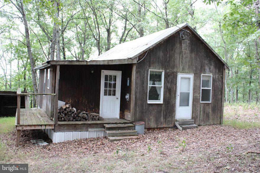 Go Big, with 82.27 Acres together with a primitive yet comfortable Cabin highlighting all the great things West Virginia has to offer. The rustic cabin meets all the basic needs with 3 comfortable bedrooms and electricity.  No formal water/septic systems have been established however; the cabin is equipped with a full bathroom that can be operational when water is delivered. Add a rain water catchment system and you’ve got the ultimate hidden cabin perfect for hunting, vacation, or a long weekend!  This is the supreme Big Mountain Escape you’ve been looking for!  Featuring Big Bucks, Big Privacy and Big Mountain Views. All the right ingredients needed for maximum enjoyment!  This property has served as a long-cherished family compound. Heavily wooded and featuring a mature stand of giant Oak and Hickory hardwoods providing the perfect habitat for whitetail deer, wild turkey, and bear.  This is the ideal scenario for those seeking both acreage and a safe haven from the metropolitan storm. Bring your backwoods knowledge and concepts and let the pioneering tradition continue.