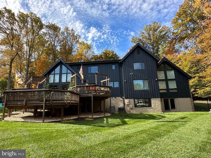 The “Lodge At Walker Lake” is a delightful combination of chic country flair, blended with a contemporary European feel, that is unique, warm, and welcoming in this luxury market. Vaulted ceilings and entire walls of custom windows let in all the natural daylight to enhance the indoor/outdoor living appeal.
The scenic custom lit driveway showcases the expansive side and front yards as set on  bountiful natural wooded and landscaped 1.87  of level, flat acreage. The outdoor pool has been improved and updated with proximity to a large multi-tiered back yard deck perfect for entertaining or just enjoying the views in your private surroundings.  
A huge bonus at The Lodge at Walker Lake is the main floor primary bedroom and remodeled en-suite bathroom. The bedroom, with cathedral ceilings and windows, showcases a grand stone fireplace and the tall windows allow for private wooded views that enhance a feeling of peace and relaxation.
With 5 bedrooms and 4 1/2 baths you have room for offices, family, and guests. There are 3 bedrooms on the upper level, all with newly renovated bathrooms. Also on the upper level is a loft -- a great space for play, an office, or second family room -- with large windows overlooking wooded views.
Two more floor to ceiling stone fireplaces warm the living and family rooms with dramatic flair.
The lowest level has a walk-out door to the large back yard, bringing in daylight, and can be used for an exercise room.  Additional rooms on this level can be used for a wine cellar, a work space, or storage. 
With over $175,000.00 in renovations and improvements, inside as well as outside, The Lodge at Walker Lake is a premiere property in the heart of Great Falls, a suburban community known for luxury and leisure. With easy access to major commuter routes, airports, Riverbend Park, Riverbend Country Club, Great Falls Park, hiking, biking, walking trails, waterfalls, shopping, dining, Wolftrap National Park, and close proximity to DC and the Kennedy Center, you will have the best of all worlds both private and cultural. So many amenities abound in this picturesque, upscale, and private neighborhood of Walker Lake. There are many wonderful features to see in this modern home. Come and see for yourself!
Expected on the market for showings and open houses in early March 2024.
This is private property so please do not walk the property unless you have an appointment.  This will be available to show on the market at 12 noon on Saturday, March 2, 2024. All offers will be due by Monday March 4th at 6 pm.