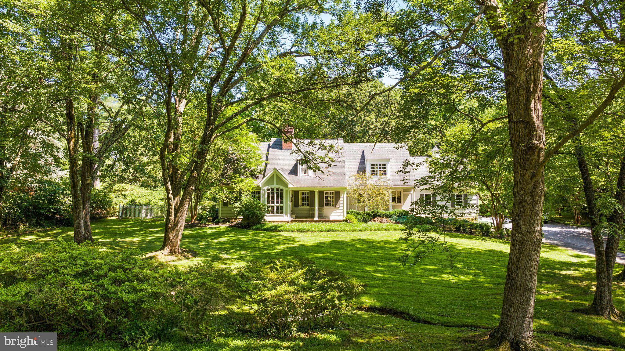 Welcome to this beautifully updated and expanded Cape Cod-style home, located just moments from the Greenspring Valley Hunt Club golf course and Garrison Forest School. Offering a blend of timeless charm and modern upgrades, this home is the perfect sanctuary for comfortable living and entertaining.
The first-floor guest suite is a standout feature, providing both privacy and convenience for visitors. It comes complete with a fully renovated, luxurious bathroom. Just off the main living areas, the cozy library or den offers a peaceful retreat, featuring handsome built-ins that add both style and functionality to the space. A perfect retreat to read a good book or entertaining space with friends.
At the heart of the home is the updated kitchen, which boasts luxurious Calcutta Gold marble countertops, custom cabinetry, and top-of-the-line appliances. It’s a chef’s dream and offers ample space for meal preparation and family gatherings. The family room, located off the kitchen, is a cozy space with built-ins and a charming wood-burning fireplace, making it ideal for casual family time or entertaining. Adjacent to the family room is a well-thought-out mudroom with cubbies and cabinets, providing a perfect spot for organizing coats, shoes, and bags as you come and go.
Upstairs the home’s enlarged primary suite is a true retreat, offering a spacious layout with a sitting area that provides the perfect place to unwind after a long day. There is an office, or additional bedroom off of the primary suite, depending on your needs. Two additional bedrooms and a full bathroom complete the second floor of the home.
Outside the large, level lot offers plenty of space for outdoor activities, while the outdoor living areas, including patios, a grilling area, and an additional wood-burning fireplace, provide the perfect setting for al fresco dining or relaxing with friends and family. The outdoor shed was originally a one horse barn- complete with a stall and space for tack and feed! A focal point of the backyard is the champion Wye Oak tree.
This home seamlessly blends modern updates with classic Cape Cod charm, offering a peaceful retreat in a highly sought-after Greenspring Valley location. Don’t miss your chance to make this stunning property your own!