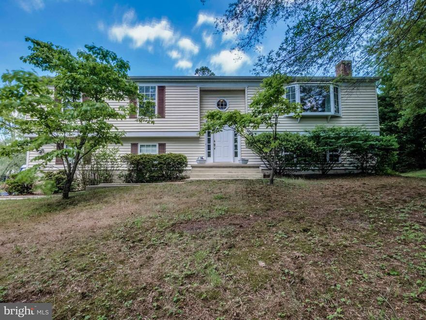PRICE REDUCED.....Charming home on1+acres w/ detached garage w/ dual entry, coy pond, tot lot, shed & deck and patio.Lovely outdoor space w/ plantings & lots of room for activities & parking.Home features inlaw suite on lower level w/ handicap bath, large living area &  kitchen amenities. Main level has delightful kitchen w/breakfast bar & door to deck, separate dining & living room.