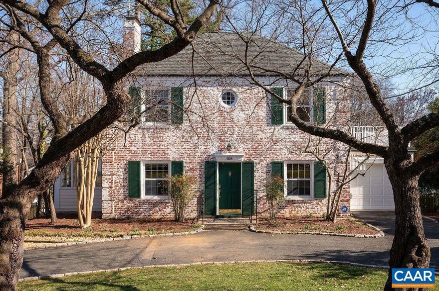 This classic Rugby Road mortar-washed brick home offers the timeless style & verdant setting that makes this neighborhood so prized. Enter to a beautifully proportioned sunny living room w/hardwood floors & wood burning FP. A triple french door invites you out to enjoy long views from the southeast facing deck. Off the living room is a charming sun porch, an ideal office or a tucked away quiet space. The formal dining room is to the right of the entry & behind it is the expanded kitchen & cozy family room w/abundant built in bookshelves & another fireplace. The kitchen has dovetail drawers, raised panel inset cabinets, gas cooktop, desk & 2nd prep/serving area with a bar sink. A powder room & on grade garage round out this floor. Upstairs is a primary bedroom with multiple closets (one cedar lined), a private rooftop deck & a spacious primary bath. Two additional bedrooms share the hall bath. The terrace level feature two multipurpose rooms, a small laundry room & a large utility/storage room. Additional features of the home: a new furnace in 2012, new HVAC is 2018, Rinnai water heater & whole house generator. With lovely mature gardens & exceptional privacy, this well loved, well lived-in home awaits your decorative vision!,Formica Counter,White Cabinets,Wood Cabinets,Wood Counter,Fireplace in Family Room,Fireplace in Living Room