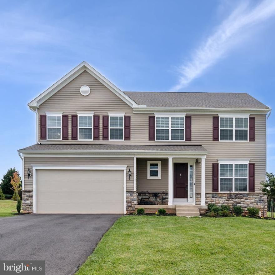 Welcome to this stunning, like-new Colonial home in the highly sought-after North Ridge community of Culpeper, Virginia. Built in 2022 by K. Hovnanian, this Hancock IV model offers over 3,700 sq. ft. of sophisticated living space and is perfectly designed for those seeking modern elegance, comfort, and convenience. Nestled on a .58-acre lot, this beautiful home features four spacious bedrooms, two and a half bathrooms, and is already roughed-in for a third bath and wet bar in the expansive basement—ready to be customized to your needs!

As you step through the grand two-story foyer, you'll be greeted by an open and airy floor plan that seamlessly blends function and style. The gourmet kitchen is a chef’s dream, boasting upgraded cabinetry, high-end appliances, and a large island perfect for meal prep or casual dining. A charming sunroom bathes the kitchen area in natural light, providing an ideal space for morning coffee or enjoying the beauty of your private backyard. Adjacent to the kitchen, the inviting family room features a cozy gas fireplace, making it the perfect spot for both relaxation and entertaining.

For those who enjoy formal living spaces, the elegant formal living and dining rooms offer the perfect setting for hosting dinner parties or special occasions. The thoughtful design flows effortlessly to the outdoor space, where the .58-acre lot presents limitless possibilities—whether you envision a deck, patio, or garden retreat, your options are endless.

Upstairs, the luxurious primary suite offers a peaceful retreat with two large walk-in closets and a spa-like bathroom complete with a soaking tub, walk-in shower, and dual vanities. Three additional spacious bedrooms share a well-appointed hall bath, offering ample space for family or guests. The walk-up basement is a blank canvas, ready to be transformed into your dream entertainment area, home gym, or media room, with plumbing already in place for a third bathroom and wet bar.

Located on a quiet cul-de-sac, this home offers unparalleled privacy and peace, with no through traffic. As the trees surrounding the property continue to grow, they will provide even more privacy and create a serene, secluded environment—perfect for unwinding after a long day.

With its stunning finishes, expansive living space, and potential for customization, this is a home that checks every box. Don’t miss the chance to make this your dream home—schedule your tour today and experience all that this exceptional property has to offer!