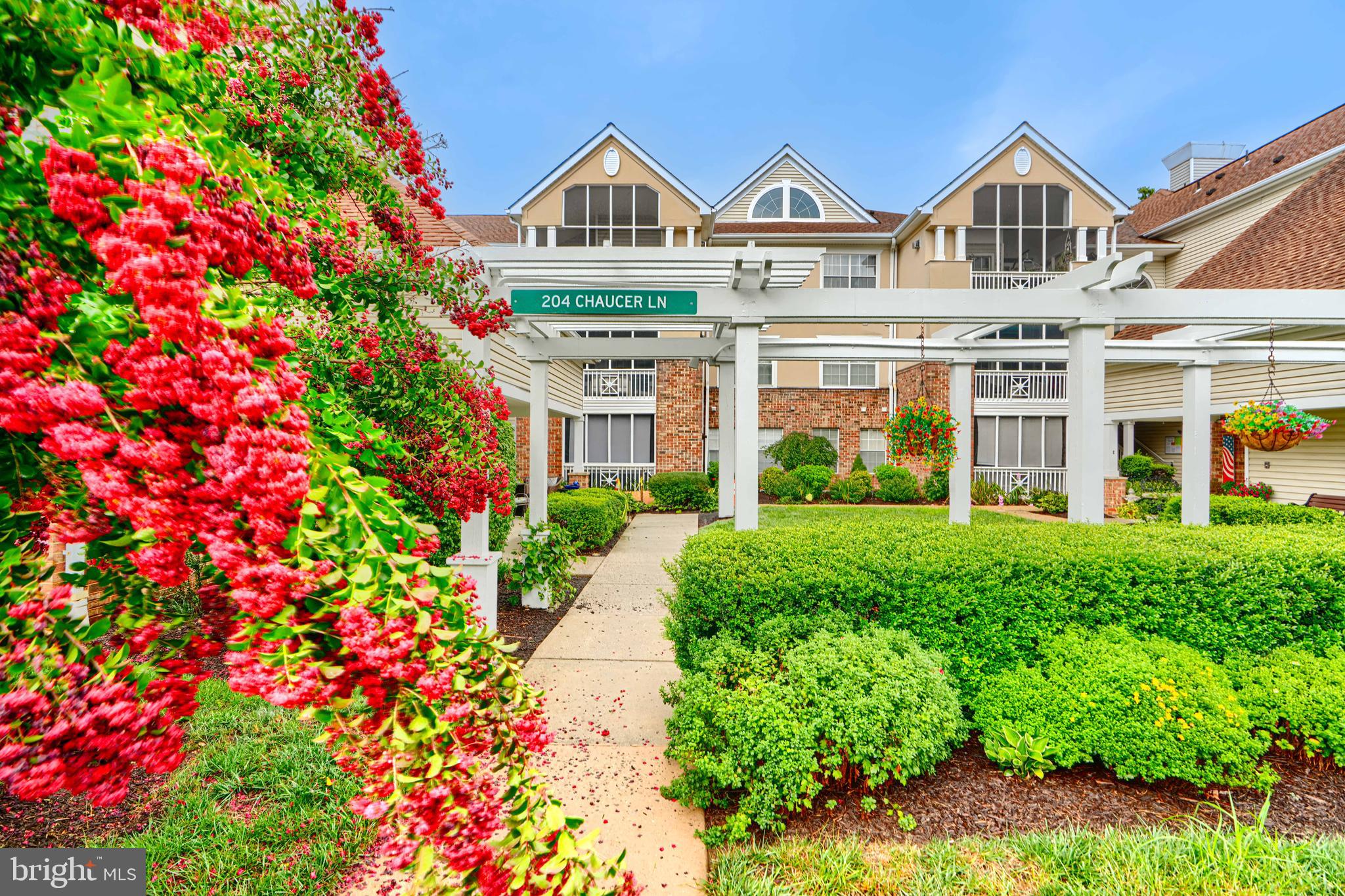 Welcome to this charming ground-level condo in English Country Manor! Condo features 2 bedrooms, 2 full bathrooms & a galley kitchen. Enjoy your morning coffee on the screened-in porch, complete with new screens, trim (2023), and new sunshade (2024). Other updates include a new refrigerator (2024), dining room blinds (2024), HVAC (2019), and hot water heater (2019), giving you peace of mind from day one. This unit also includes a rarely available, separately deeded Garage (#9), providing additional convenience and storage. Please note there is a $45/month garage fee. In addition to the garage, owners are permitted two parking spaces, one near the building and one in the overflow.
Living here means more than just a home, you’ll have access to the Community Pool, Gym, and the Manor House & Clock Tower, perfect for hosting your next celebration. Explore the beautifully maintained grounds featuring two peaceful ponds and even two convenient car wash stations. All this, in a desirable Bel Air location close to shopping, dining, and everything you need. Move right in and enjoy the relaxed lifestyle this community has to offer! This sale is an As-Is Sale.