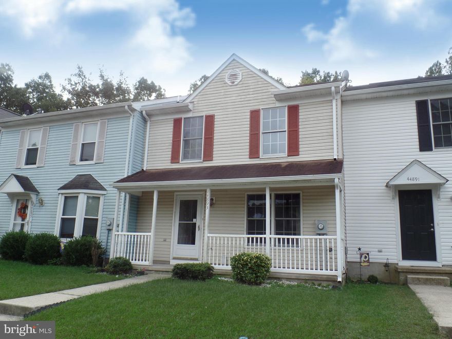 Owner is in the process of adding a full bath in the master bedroom. There will also be a new refrigerator.  Please excuse the mess!  This home has  New carpet, new flooring, fresh paint.  The first floor has an additional room that could be an office or a bedroom if you prefer.  Fenced in back yard and a large living room.  Front porch and a back deck. Ready in November!