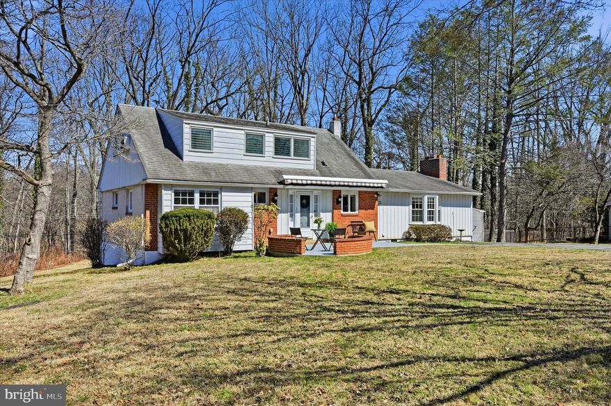 Welcome to 51 Rampart E, located in the highly sought-after Riddlewood neighborhood. This charming Cape Cod offers 5 bedrooms and 2 full bathrooms and is beautifully situated on .41 acres. The inviting front patio creates the perfect spot to relax and enjoy warm spring and summer days. Step inside to a spacious foyer featuring a convenient coat closet and drop station, ideal for organizing keys, mail, and everyday essentials. The kitchen features classic oak cabinetry and a window above the sink overlooking the front yard. Just off the kitchen is a huge addition that includes a generous dining area flowing seamlessly into the family room, highlighted by a charming floor-to-ceiling brick wood-burning fireplace with a raised hearth. A full wall of built-in storage cabinets provides both character and functionality. Sliding doors lead to the screened-in back deck, perfect for enjoying peaceful outdoor living. The formal living room offers flexibility and could easily serve as a dining room if desired. The main level also features a bonus 5th bedroom or flex space, perfect for a home office, playroom, or guest room. Two additional bedrooms and a full hall bathroom complete the first floor. Upstairs, you’ll find two sizable bedrooms and a full hall bathroom with a tub/shower combination. The walkout basement feels bright and inviting thanks to floor-to-ceiling windows along the back wall, allowing for an abundance of natural light. This level offers two finished flex rooms, along with a storage area, laundry closet with utility sink, and a separate utility room. Outside, enjoy the mostly flat backyard with peaceful wooded views, offering privacy and space for outdoor activities, gardening, or relaxing. LOCATION, LOCATION, LOCATION! This home is in the award-winning Rose Tree Media School District, just around the corner from Wolff's Apple House. It's also close to Media Borough, offering dining, shops, and events, and minutes from Granite Run Promenade with dining, retail, and gyms. Outdoor attractions such as Ridley Creek State Park, Tyler Arboretum, Chester Creek Trail, and Linvilla Orchards are nearby. The Riddlewood Swim Club is within the neighborhood.   Commuting is easy with quick access to 352, RT 1, 476, and  Media-Wawa train station. Enjoy suburban life with easy access to the city and PHL International Airport. Don’t miss out on this beautiful home and ideal location. Make an appointment today. Home is where your story begins!