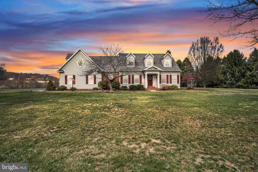 This Cape Cod-style home offers a peaceful retreat just minutes from downtown Hershey medical facilities, businesses, and attractions, giving you the best of both convenience and privacy. Sitting on nearly 8 acres of land, this house on a hill boasts beautiful views of farmland and mountains, providing a relaxing atmosphere where you can watch birds and deer, or whatever animals you decide to raise on this property, classified as Green and Clean!
Inside, you'll find a bright foyer with plenty of natural light and hardwood floors throughout. A cozy sitting room with French doors offers a quiet spot to unwind. The first floor has a large bedroom with an en suite bathroom, including a walk-in shower. The kitchen features granite countertops and an island, which flows into the dining area and then into the main living room, where a brick fireplace with a gas fireplace insert adds warmth and charm.
For those who love being outdoors, the screened-in porch is perfect for enjoying your morning coffee while taking in the beautiful views. The first-floor laundry room with a utility sink and storage cabinets, is conveniently located near the three-car garage, which has new garage doors.
Upstairs, you'll find three more bedrooms. The main bedroom has its own en suite bathroom with a large shower. There's also a large walk-in closet with lots of storage space that connects to a versatile room that could be used as an office, craft room, gym, or anything else you need. A full bathroom with a tub and shower completes the second floor.
Recent updates include  a newer roof (2021) and driveway sealing.  Another notable feature of this property is a geothermal system for low heating and cooling bills. Minutes from 322 and a short ride to I76 (Pennsylvania Turnpike).
173 Lawn Road is a gem! This property offers comfort, practicality, and peaceful surroundings, making it a great place to call home.