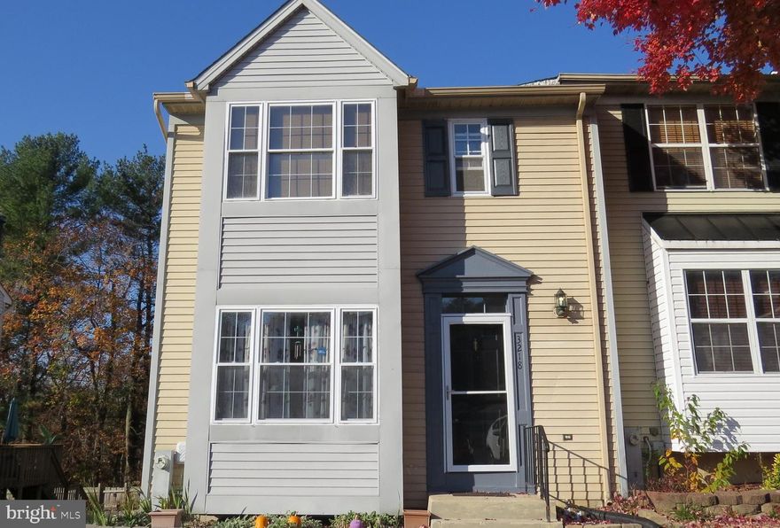 Welcome to 3218 Rock Creek Ct.  a unique and spacious end of group townhome that has been freshly painted and ready for you to enjoy.  The main level features a half bath, sunken living room with a two sided wood burning fireplace that can be enjoyed from the living room as well as the dining room.  The kitchen has an additional dining area and sliding glass doors to an enormous deck newly updated with decking and rails.  The upper level has a primary bedroom with full bath as well as two additional bedrooms and a hall bath with a barn door for added space.  The lower level has a large  laundry/ utility room with lots of storage as well as the  family room with sliding doors to the spacious  patio and fully fenced private back yard .  A rough in for another bath is also present but is used for additional storage.