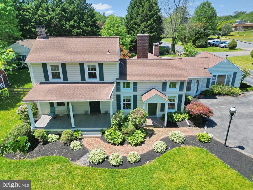 If Authenticity, Historic Charm and a Beautifully Unique, Forever Home is what you're seeking, your search is over!  Where Historic Elegance Meets Modern Luxury! This One-of-a-Kind Home in Fallston checks off all the boxes! Step into timeless charm and contemporary comfort w/this extraordinary 2,500 sq. ft. circa 1850s historic home, fully remodeled to perfection. Nestled on a .62-acre landscaped lot w/ Private gardens & view of the Quaker Meeting House, this 4 BR, 3 & 1/2 BA residence is The Belle of Harford County. Upon entering this gorgeous home you'll find sun-filled rooms & a flowing, open floor plan, perfect for entertaining guest, a "working from home" dream environment, or just enjoying a staycation at home in your own private retreat.  Starting w/the kitchen, just imagine the gourmet meals you will create in this updated Top Chef's Dream-Come-True kitchen w/stunning white quartz countertops, a custom coffee bar, & GE Profile stainless steel appliances designed for entertaining & everyday luxury. Tucked out of the way but perfectly convenient is the first-flr laundry w/high-efficiency LG W&D adds convenience and style. The spacious main-level primary suite features elegant new built-ins & serene garden views, blending indoor & outdoor living. The newly updated en-suite Bath offers a large double shower, double vanity, & custom quartz built-ins reminiscent of a spa-like retreat you’ll never want to leave. On the other side of this amazing home, in its own private wing find a second en-suite bedroom which provides flexibility for guests or multigenerational living, while the 3rd & 4th BRs located upstairs are generously sized & suitable for office, creative crafting, workout-spa or whatever your heart desires! These two bedrooms share the 3rd full bathroom.  A huge Bonus feature is the modern detached studio/office/recreation room w/vaulted ceilings & extensive storage, secluded behind the house backing to trees.  You'll love this space for how well it adapts to being the perfect location for remote work, hobbies, entertaining, the possibilities are endless! The built-in desks can stay as well as the pellet stove to cozy up to on chilly days and nights! You'll love spending time walking the grounds of this home w/its impressive, extensive, professional landscaping that goes on and on.  Timeless classics like, hydrangea, peonies and a myriad of hostas grace this magnificent property's front, back & side yards, a reflection of the years of meticulous love & care given to the wellbeing of this home. The back yard patio features a gas powered firepit, & private deck & garden area off of the primary bedroom. There is extensive storage with two spacious storage sheds-one 10' x 20', the other 10' x 14'—ideal for tools, gardening supplies, or recreational gear. The fully fenced backyard offers both privacy & a welcoming place in a park-like setting to relax or gather. Tomatoes and herbs are already planted for you. The unfinished basement is ready for your workshop, gym, or studio, and the home is equipped with warm, energy-efficient oil heat via forced air vents in winter & CAC via heat pump in summer, ensuring year-round comfort. Lovingly maintained by one family for 40 years, this home is a rare blend of historic soul and contemporary style-ready for YOU to begin its next chapter. As an additional benefit, the Gunpowder State Park is less than a mile away w/tons of trails for hiking and biking & a very fun swimming hole in Little Gunpowder falls.  Finally, You can volunteer to host the Reunion, The Big Game, Movie Night, Crab Feast, Garden Party or Holiday Festivities!!! Your home will be the place to be! Off the beaten path yet Close to everything you need! APG, Hospitals, Schools, Parks and Rec, Libraries, Restaurants, Marinas and major arteries of travel!  Don’t miss this unique opportunity to own a beautifully reimagined piece of Fallston’s history. 
Welcome home to 716 Old Fallston Rd. "NO HOA"!