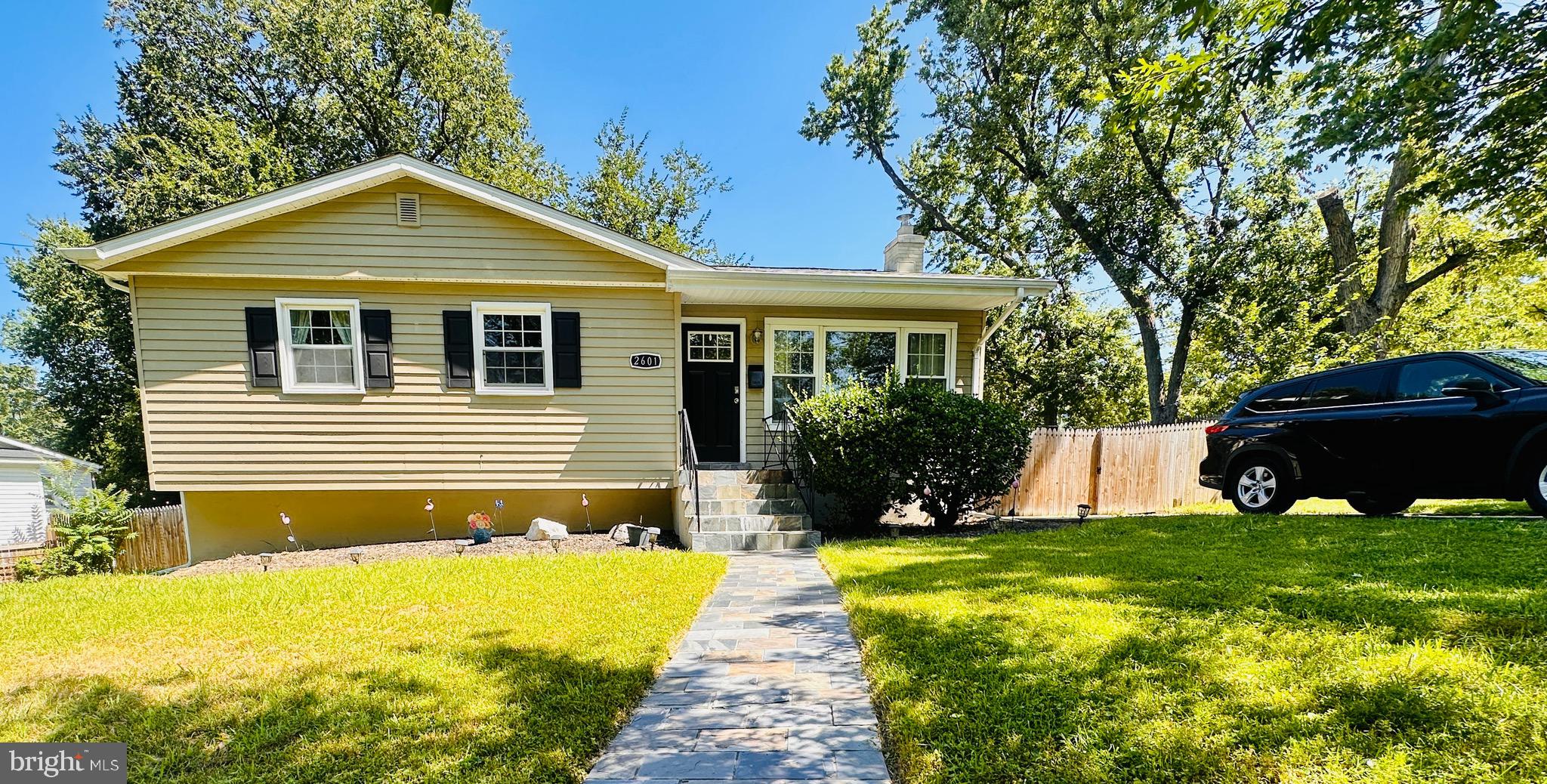 Best of Silver Spring! This beautifully updated 4-bedroom, 2-bath home features a gourmet kitchen with quartz counters, stainless appliances, and an open-concept layout leading to a deck and patio. Renovated baths include marble and porcelain finishes. The fully finished lower level offers a large living area, bedroom, and bath—perfect for everyday living or roommates. Enjoy hardwood and luxury vinyl floors, crown molding, and abundant natural light. Set on a ¼-acre corner lot with a fenced yard, XL driveway, and quiet no-through street, just minutes to Metro, parks, shopping, dining, and major routes.
