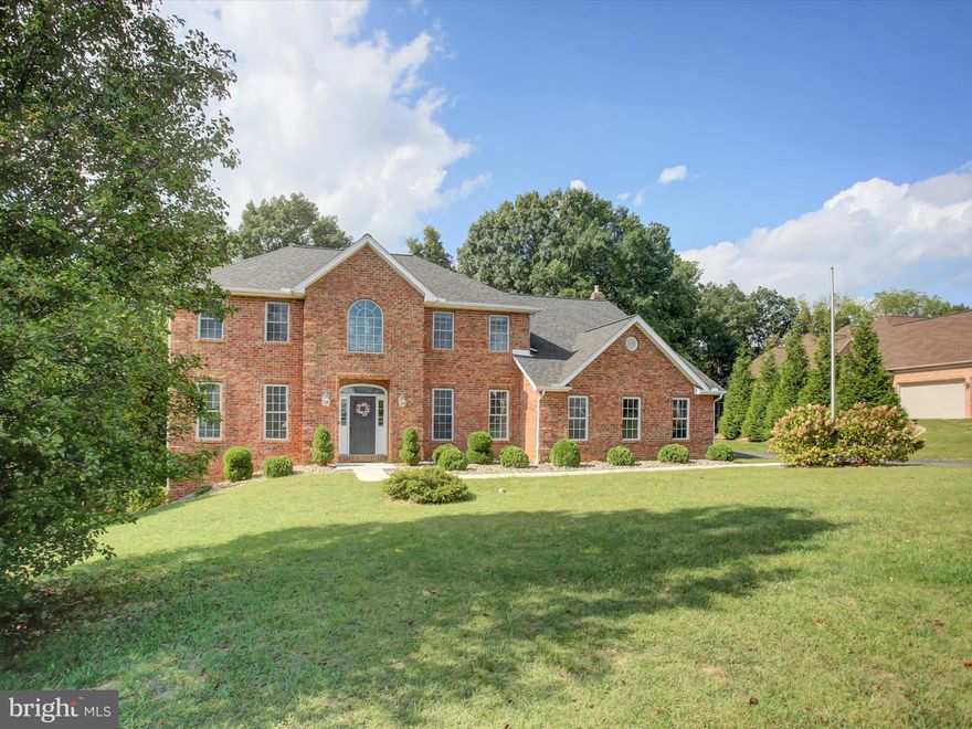 Back on the market!   Welcome to 2384 Castlegreen Drive—an elegant brick colonial set on 2.54 private acres with a beautifully updated interior and a setting that offers both privacy and convenience. The heart of the home is the stunning, fully renovated kitchen featuring a 10-foot island, custom cabinetry, granite countertops, designer backsplash, and updated flooring. A newly added patio door creates an easy flow to the outdoor living space—perfect for everyday living or hosting guests. Natural light fills the main level, where a functional layout and wooded backdrop create a warm, inviting atmosphere. Upstairs, the spacious primary suite offers vaulted ceilings and a renovated bath with tile finishes, double vanities, and a glass-enclosed shower. Three additional bedrooms provide flexibility for a variety of needs. The finished walkout basement expands the living space, a built-in bar, and a professionally installed waterproofing system—ideal for entertaining or relaxing. Additional highlights include a high-wind resistant roof, dual heat pump systems, water treatment system, radon mitigation, and upgraded attic insulation (R-60+, 2025). Interior updates such as refinished hardwood floors, fresh paint, modern lighting, and updated stair details add to the home’s appeal. Enjoy outdoor living with deck and patio space, a side-entry two-car garage, and a peaceful, private setting. Conveniently located near major routes, shopping, and dining, this home offers the perfect balance of comfort and accessibility.
