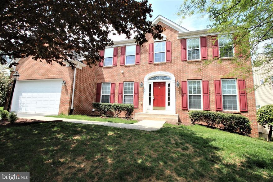 SH 12 YEARS* PRISTINE CONDITION*4 BRS, 3.5 BA*2 CAR GARAGE**2 STORY FOYER*GOURMET KITCHEN W/GRANITE COUNTER TOPS & CHERRY CABINETS*BREAKFAST BAR*HARDWD MAIN LEVEL* SUNRM JUST OFF KITCHEN*HUGE FAMILY RM W/ FIREPLACE*LIBRARY MAIN LEVEL*HUGE MASTER BEDRM W/ SITTING AREA & LUXURIOUS MASTER BATHRM*BASEMENT FULLY FINISHED WALK-OUT LVL*CERAMIC TILES*HUGE REC RM*FULL BATH & A DEN* SPACE FOR HOME THEATER.