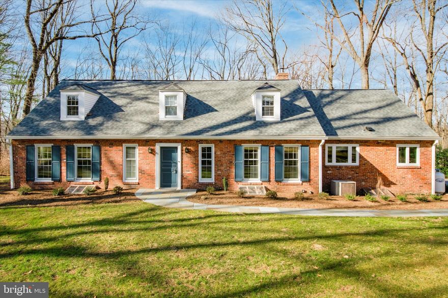 Welcome to this beautiful 4 Bedroom, 2.5 Bath brick Cape Cod, nestled on a quiet, tree-lined street in the Northwoods neighborhood of Wayne. New paint and landscaping add to the already abundant curb appeal of this charming home. Enter into the Foyer with newly refinished wide-plank hardwood floors and fashionable paneled walls. The spacious Living Room features an attractive wood paneled wall with gas fireplace, abundant natural light from the oversized 12 pane window, and access to the stone paver patio, overlooking the 1+ acre of mature landscaped grounds. The adjoining Dining Room with double windows and (another feature about the dining room) offers an ideal space to host dinners. The Kitchen boasts modern gray cabinetry, marble countertops, stainless steel appliances, and a tile backsplash surround for the range hood, creating an attractive focal point. A breakfast bar with pendant lighting adds convenient seating to the space. The rich hardwood floors continue to the main level Primary Suite with backyard views, ample closet space, and ensuite Bathroom with vanity and glass-enclosed shower. Across the hall sits a light-filled wood paneled room with floor-to-ceiling solid wood built-ins, perfect for an office, den, or nursery. An updated Half Bath with vanity completes this level. Head upstairs to find 2 spacious Bedrooms with dormers creating sunny alcoves and a Full Hall Bath with vanity and shower/tub combo. The 4th Bedroom is accessed via a private staircase off the Kitchen and has another level offering a small private space perfect for an office or quiet reading nook. The basement is partially finished, providing additional living space/playroom and storage. The serene outdoor space offers privacy and plenty of opportunity for entertaining in the warmer months or simply enjoying nature. A truly amazing neighborhood, close to the local shops & restaurants of downtown Wayne, public transportation, and major highways including I-76, I-476, and Route 30. This unique home is a must see and won’t last long!