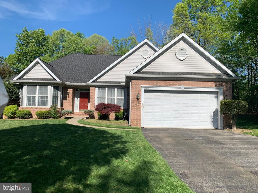 AN ABSOLUTE  MUST SEE -  Looking for a spectacular single family home in Laurel_ This is a  BIG Beautiful -Light and bright , 4 bedroom /3Full baths  brick raised rambler with 9'ceilings and 2 car garage  on a quiet cul-de-sac. The foyer entry leads to a spacious living room  and separate dining room with double sided gas fireplace. The living room has sliding glass doors to the large deck for wonderful  events and entertaining.  The Great Gourmet kitchen has a breakfast room and  is a perfect family  Gathering space.  White cabinetry, granite , ceramic tile backsplash, stainless steel appliances and an island cooktop make the perfect  open floor plan and a  gorgeous modern look!  The master bedroom has an ensuite bathroom with a magnificent clawfoot tub and chandelier. There are floor to ceiling windows and a WIC. There are 2 other spacious bedrooms on the main level with another full bath.  The Large lower level  also has an  open  floor plan  and a walkout to the lovely backyard area .  There is a 4th bedroom , full bath  and another bonus  room which can be used as a den/office/fitness or other  room of your choice. Separate laundry room. Off street parking in the driveway for 2-4 more vehicles.  There's a nice community pool and other amenities. The community is centrally located and good for commuting . RT 95,  RT 295 and RTs 1 & 200 are easy to get to. AGENTS: Please call me if you have an interest in writing an offer. It would be my pleasure to work with you on this lovely home and concluding to a smooth quick closing!