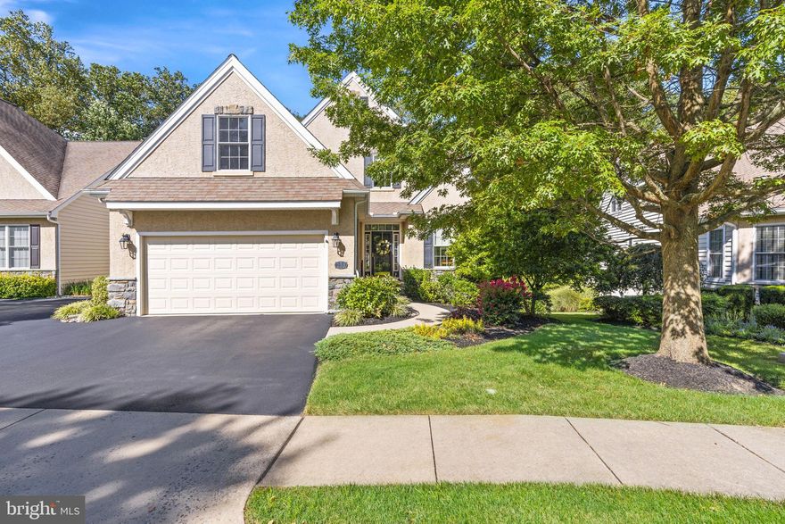 Upgrades galore elevate this Wilkinson built 3-bedroom, 3-bath home in the prestigious community of Harrogate. Located on a prime lot backing to wooded space, this pristine home shows beautifully.  Featuring an impressive entryway with custom stained glass front door surround and gleaming hardwood floors on most of the main level, this spacious open floor plan lends itself seamlessly to everyday living with an elegantly appointed formal dining room flowing to the fabulous chef’s kitchen with granite countertops, stylish tile backsplash, beautiful white cabinetry, breakfast bar offering an additional seating area and stainless-steel appliances plus breakfast room with sliders to the multi-level deck.  Kitchen opens to the generously sized living room at the heart of the home with gas fireplace and built-ins.  Main floor primary suite has two walk-in closets with custom shelving; bathroom with two vanities and tiled shower.  Secondary bedroom/sitting room, full hall bath and laundry room round out the main level.  The upper level does not disappoint with the same level of quality that lives on the main floor with voluminous great room plus upgraded, additional space perfect for an office area, bedroom and full bath; allowing guests and visitors to feel right at home.  Don't miss the opportunity to live in this fantastic community in a great location, close to Delaware tax free shopping!  *Monthly association fee of $225 includes clubhouse, trash removal, grass cutting and lawn maintenance, snow removal and common area maintenance.