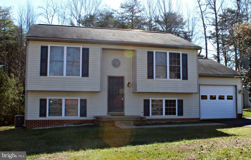 Spacious 4 bedrooms, 2 baths, backs to woods.  Open living room upstairs, great rec room on lower level. Don't miss out on this great location. Washer&dryer included as-is.