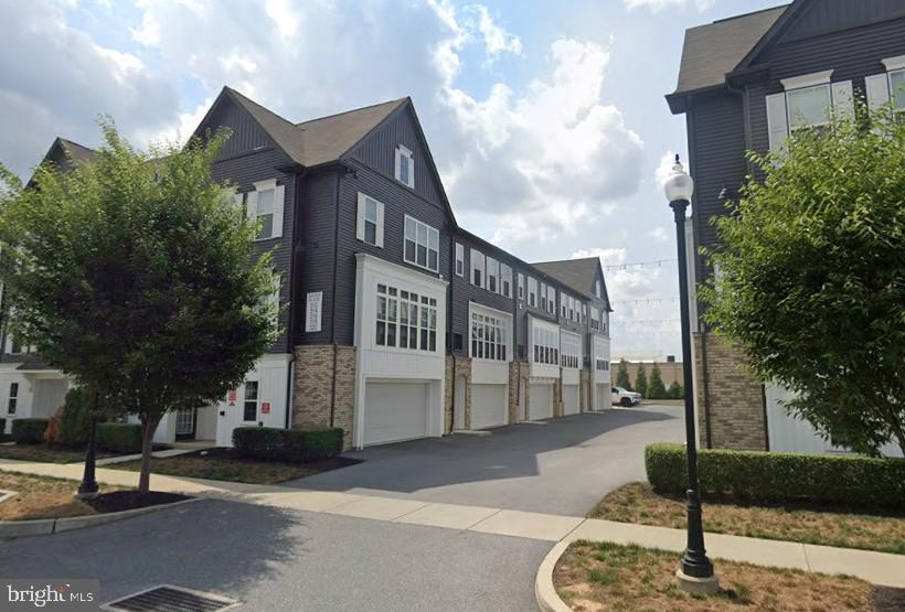 Incredible convenience in this luxury townhome with light-filled, spacious rooms and an open floorplan. Located in Manheim Township and only steps away from 30 restaurants and shops, including Whole Foods Market and Target, this home provides easy access to Routes 30, 283 and 222. This spectacular townhome with 9-ft ceilings features painted maple cabinets, quartz countertops, SS appliances and large windows with wooden blinds. The foyer welcomes you into the home with its 2-car garage and laundry room on the lower level. Upstairs, the main level highlights an open floorplan with hardwood flooring, a gourmet kitchen with large center island with a dining room - living room combination and powder room. The upper level offers a full hall bathroom with tub/shower and 2 large bedrooms. The larger primary bedroom with a walk-in closet has a bathroom ensuite with double vanity and tiled walk-in shower. Commuting is easy with Lancaster Train Station one half mile away and Lancaster City just beyond. No smoking. No pets. Tenant pays utilities. Move-in November. Call for more information and to schedule a tour.
