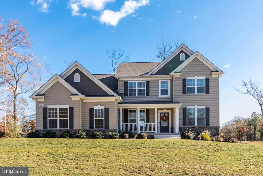 QBHI's 2 year young D1 Fairfax in sought after Fischer's Grant!  The homeowners did not miss a thing when choosing their custom options with Quality built homes.. from the 2.5 sideload garage with mudroom, grand kitchen with double wall ovens, built in microwave, HUGE Island with pendant lights, hardwood flooring, stone surrounding their gas fireplace in the family room and coffered ceilings.  The gorgeous staircase is oak with painted white risers, gorgeous arch window in the stairway, the upper level has the owners suite with a tray ceiling, separate sitting area, 2 Walk in closets, deluxe shower, double vanities and soak in tub.  3 additional bedrooms (one with a walk in closet) laundry upstairs and hall bathroom has double vanities with a door separating the shower and toilet area from the sinks.  The basement is unfinished for lots of storage and future plans.  All of this on a large, gorgeous lot.  This neighborhood is stunning, drive through and imagine living there.  The 2-10 builders warranty is transferrable and seller is flexible with settlement. Call today!