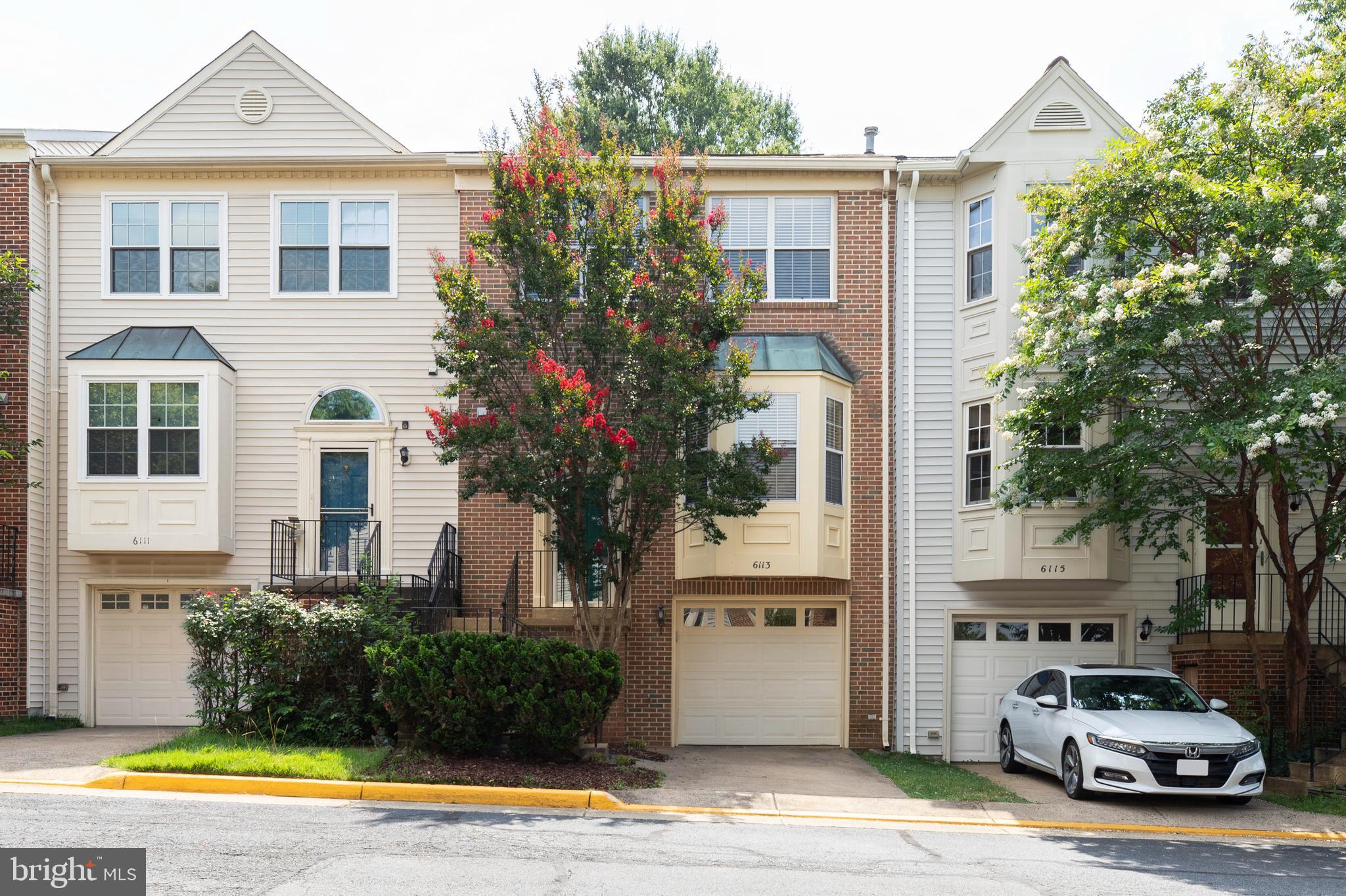 Stunning Brick-Front Townhome with 1-Car Garage in the Highly Sought-After Singleton's Grove Community! Welcome to this beautifully maintained townhome, featuring a custom-built double deck with stairs and a fully fenced yard—perfect for outdoor entertaining, barbecues, and relaxing evenings. Inside, you'll find gleaming Bruce hardwood floors, a ceramic tile foyer, and fresh paint throughout the entire space. The sunken living room, featuring a charming bay window, flows seamlessly into the formal dining room, which is highlighted by elegant Roman columns. The upgraded kitchen includes granite countertops, a breakfast bar, and stainless steel appliances. Additional updates include newer appliances and a washer/dryer, new carpet (2022), and refinished hardwood floors (2022). The spacious primary suite boasts a luxurious en-suite bathroom with granite double vanities. A bright skylight and high ceilings enhance the upper level, which features California-style carpeting and ample closet space. The walk-out lower level offers Berber carpeting, a large recreation room, and a cozy gas fireplace—perfect for entertaining or relaxing. Additional Highlights: Custom double deck with stairs and fenced backyard. Convenient walk-out basement, finished lower level ideal for a home office, gym, or guest suite. Generous storage room in the basement. Located minutes from H Mart, Lotte, Trader Joe’s, and a variety of shopping and dining options. Easy access to Rt.. 28, Rt. 66, and Rt. 286 for effortless commuting. Close to Chantilly and Lawrence Park for walking and recreation. Near golf courses and other outdoor amenities, this home offers the perfect combination of comfort, style, and convenience. Schedule your private tour today!