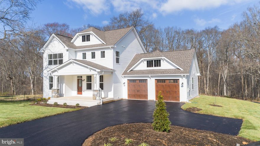 Public Open Houses Saturday 3/28 and Sunday 3/29 from 1-3pm. ***BRAND NEW & MOVE-IN READY*** this stunning Arts & Crafts Davenport model by local builder Trophy Custom Homes blends timeless design with modern luxury. Set at the end of a private cul-de-sac on a premium 1-acre home site, this property offers both privacy and functionality. From the welcoming front porch, step into a thoughtfully designed main level which features a private office, formal dining room, and an open concept family room with a stately modern fireplace. At the heart of the home, the gourmet eat-in kitchen impresses with premium quartz countertops, tasteful high end floor-to-ceiling dove and timber cabinetry, Frigidaire appliance package, a walk-in pantry, farmhouse apron sink, and a large island with breakfast bar. Rounding out the main level is a generously sized sunroom clad with large picture windows – a perfect setting for a formal sitting room, children’s playroom or secondary dining space. Upstairs you will enjoy 4 bedrooms, 2 full baths and the laundry room. The primary suite includes luxury vinyl plank flooring, a walk-in closet and overlooks the private backyard with sweeping views of the mature woodlands. The spa-inspired ensuite bath features an expansive 7x6 walk-in shower boasting dual shower heads and floor-to-ceiling tile. The walkout lower level includes 9ft ceilings, a finished multi-purpose recreational room, a 3rd full bath, spacious 5th bedroom and ample storage space. Additional highlights include 7-inch LVP flooring throughout the main level, shake siding with stone column bases, public sewer (no private septic), 2x6 construction, Pella windows, ceramic tile in all baths and laundry, 92% efficient HVAC system, and 30-year architectural shingles. With no HOA or restrictive covenants, this home offers rare flexibility and freedom in a highly desirable Poolesville, MD location, convenient to Washington, D.C. and major commuter routes I-270, I-70 and MD-495. This beautiful home will not last long, schedule your private tour today!