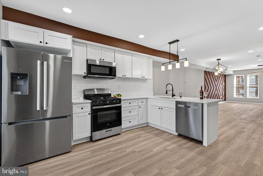 Welcome to this fully updated three-level home  with 5 bedrooms and 3 Full bath, located at  Mosher neighborhood! The main level offers a bright open-concept layout highlighted by a stylish accent wall and a brand new kitchen featuring a modern peninsula, quartz countertop, stainless steel appliances, backsplash, recessed lighting, and contemporary fixtures throughout.
The upper level offers three spacious bedrooms, including a primary suite with a private full bathroom, providing comfort and privacy. The finished lower level adds incredible versatility with two nice sized bedrooms, a full bathroom, laundry included. 
Step outside to enjoy a fully fenced backyard, ideal for entertaining, relaxing, or outdoor activities. Conveniently located near shopping, dining, to the many amenities of beautiful Gwynns Falls/Leakin Park and an easy commute to Downtown. Schedule your private showing today