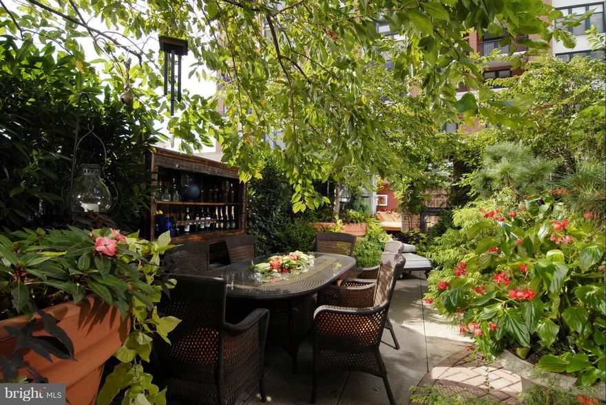 An urban oasis! One-of-a-kind garden duplex in luxurious Harbor East condo with 24-hour security. This magnificent home features two master bedrooms and a separate guest house/third bedroom across a lush oversize terrace with mature trees and abundance of greenery. Main floor has great flow with kitchen open to combo dining/living room + great views of the garden. Masters have connecting balcony.