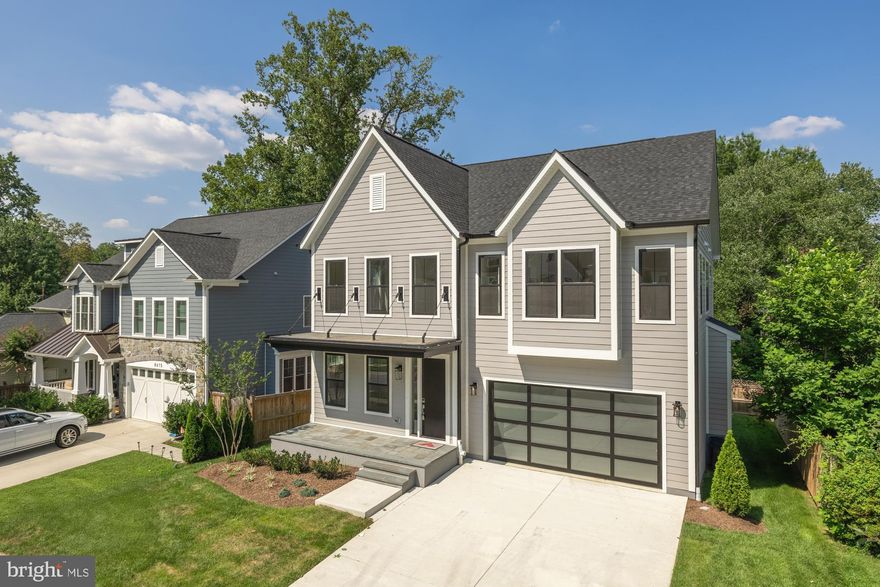 Best price for new construction in the Whitman High School area, which was just ranked the #2 school in Maryland and #130 nationally on the 2025 Best High Schools list by U.S. News & World Report. Step into the allure of this new home beautifully crafted by Afnan & Co in Bethesda where 5,100 square feet of modern elegance redefine traditional styling with a contemporary twist. The eye-catching front entry, complete with a floating porch canopy and sleek garage door, offers just a hint of the sophisticated design elements found throughout the home, including contemporary slab cabinetry and millwork.

On the main level, discover a versatile parlor with smooth glide pocket doors—perfect as a home office, music room, or formal entertaining space—adjacent to a spacious dining room designed for memorable gatherings. The open-concept family room and eat-in kitchen are bathed in natural light, featuring two-tone cabinetry, oversized windows, and an inviting layout for seamless living. A thoughtfully appointed mudroom with a walk-in pantry leads to the two-car garage, outfitted with a modern glass overhead door and EV-ready charging station.

The second floor hosts a luxurious primary suite, complete with a private entry foyer, dual walk-in closets, a dressing area, and a spa-inspired bathroom featuring a freestanding vessel tub and walk-in shower. Three additional bedrooms, each with its own walk-in closet, two full bathrooms, and a spacious laundry room complete the second level. Ascend to the third level to find a fifth bedroom with an en-suite bath and an expansive loft area, perfect for additional living or entertainment space.

The lower level includes a sixth bedroom and full bath, ideal for guests, au pair, or nanny. Double glass doors open to a versatile space ideal for an exercise or theater room, while windows brighten the spacious recreation room. Two large storage areas complete this level, providing ample space for organization. Outdoors, the flagstone patio creates an idyllic setting for entertaining, surrounded by lush landscaping that enhances every gathering. Situated in a highly sought-after Bethesda location, this exceptional home offers both convenience and prestige in one of the area’s most desirable neighborhoods.